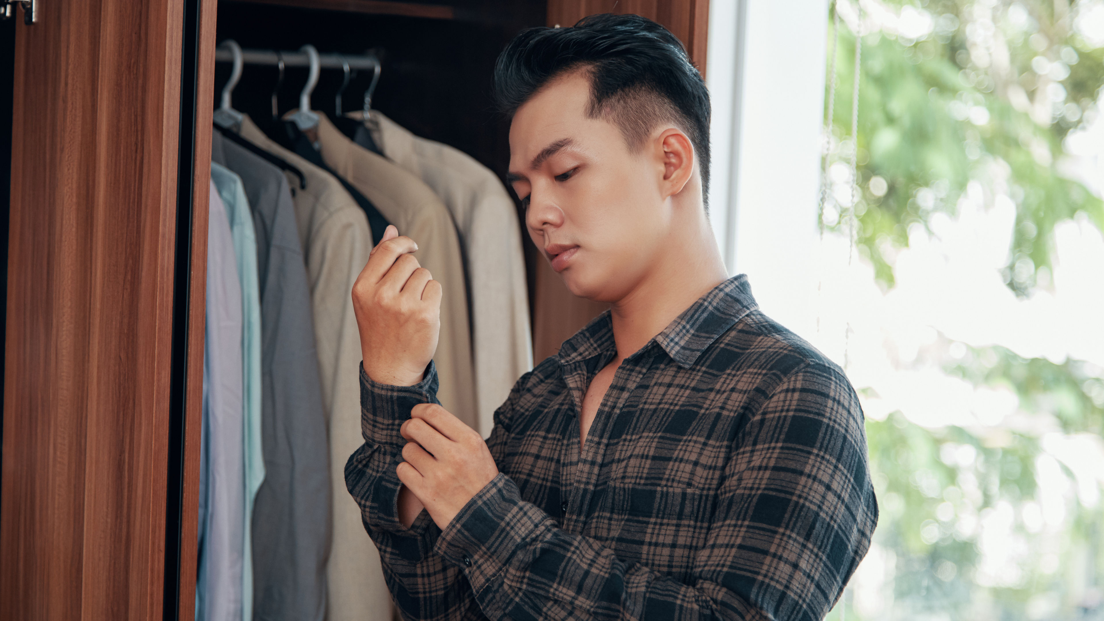 A man is getting ready for work