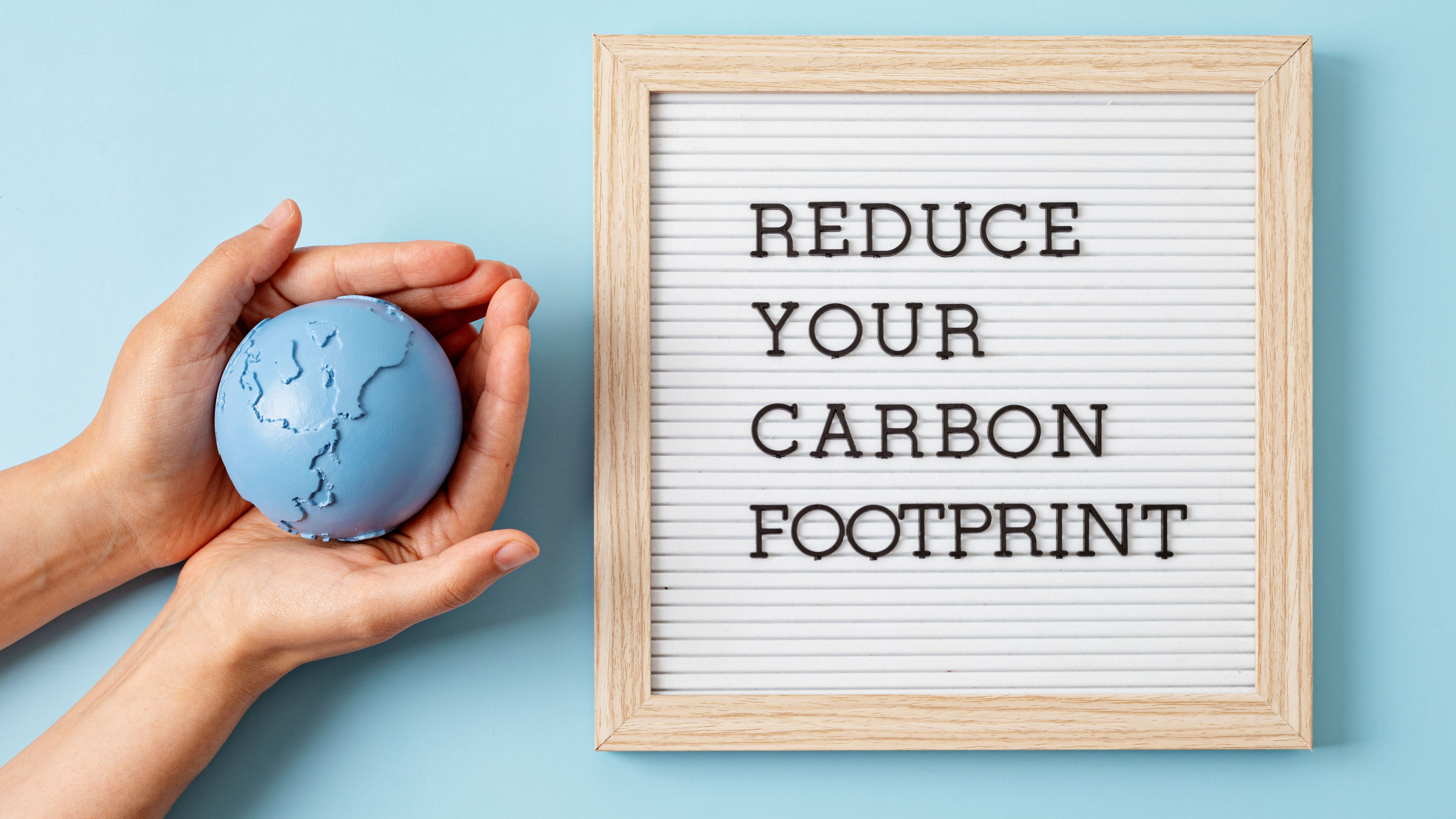 Letter board with text reduce your carbon footprint 