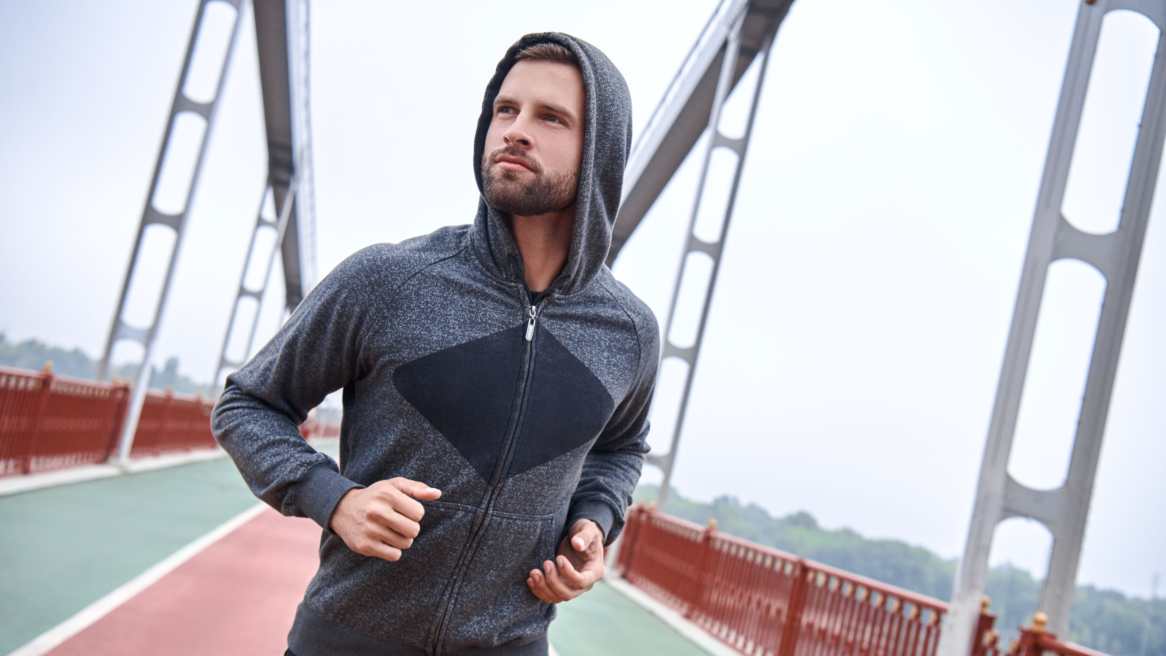 A man running in sports hoodies