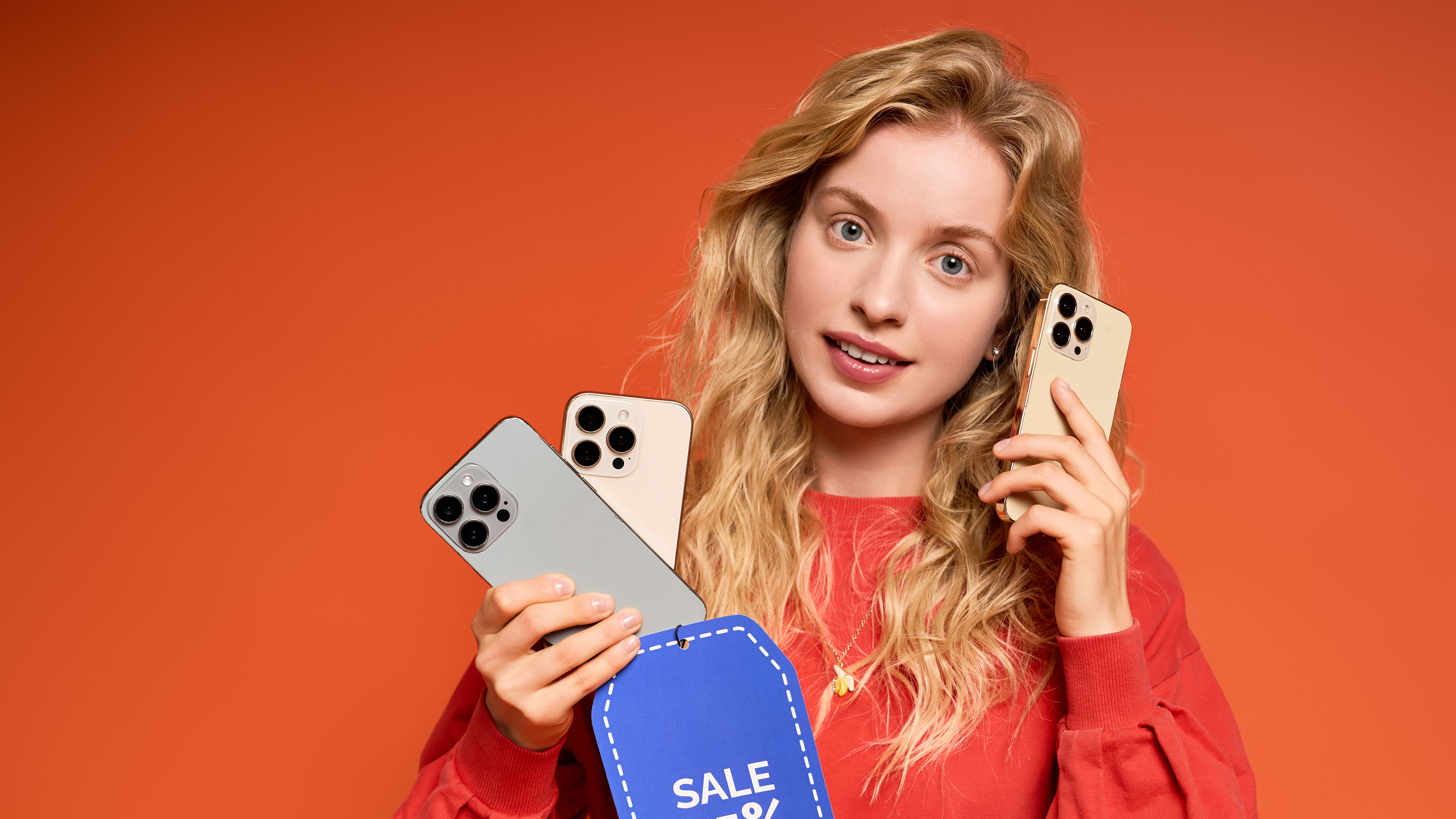 Excited Woman Holding Smartphones