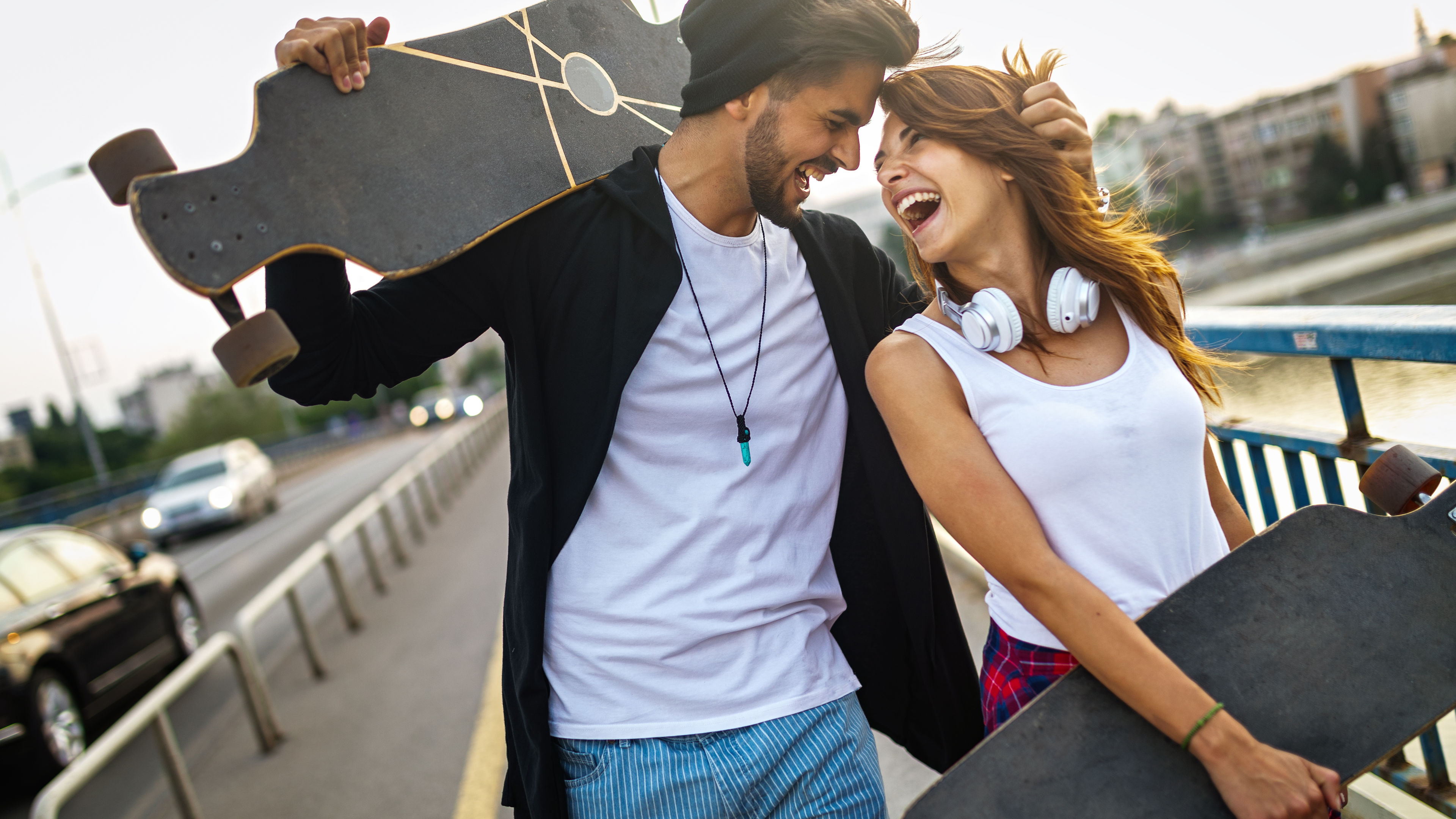 Portrait of young happy people with skateboards having fun together outdoors 