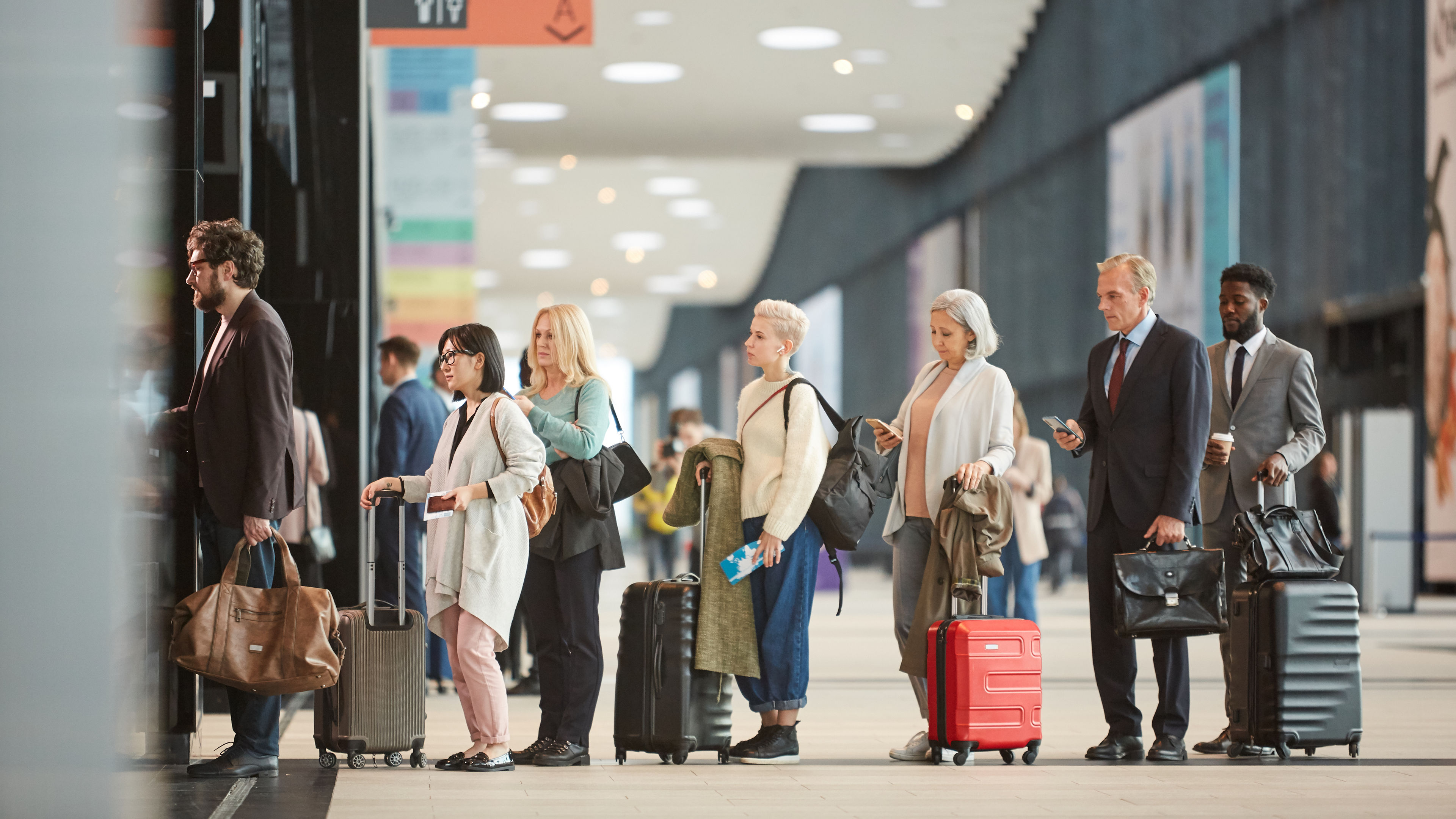 There is a long queue at the airport. 

