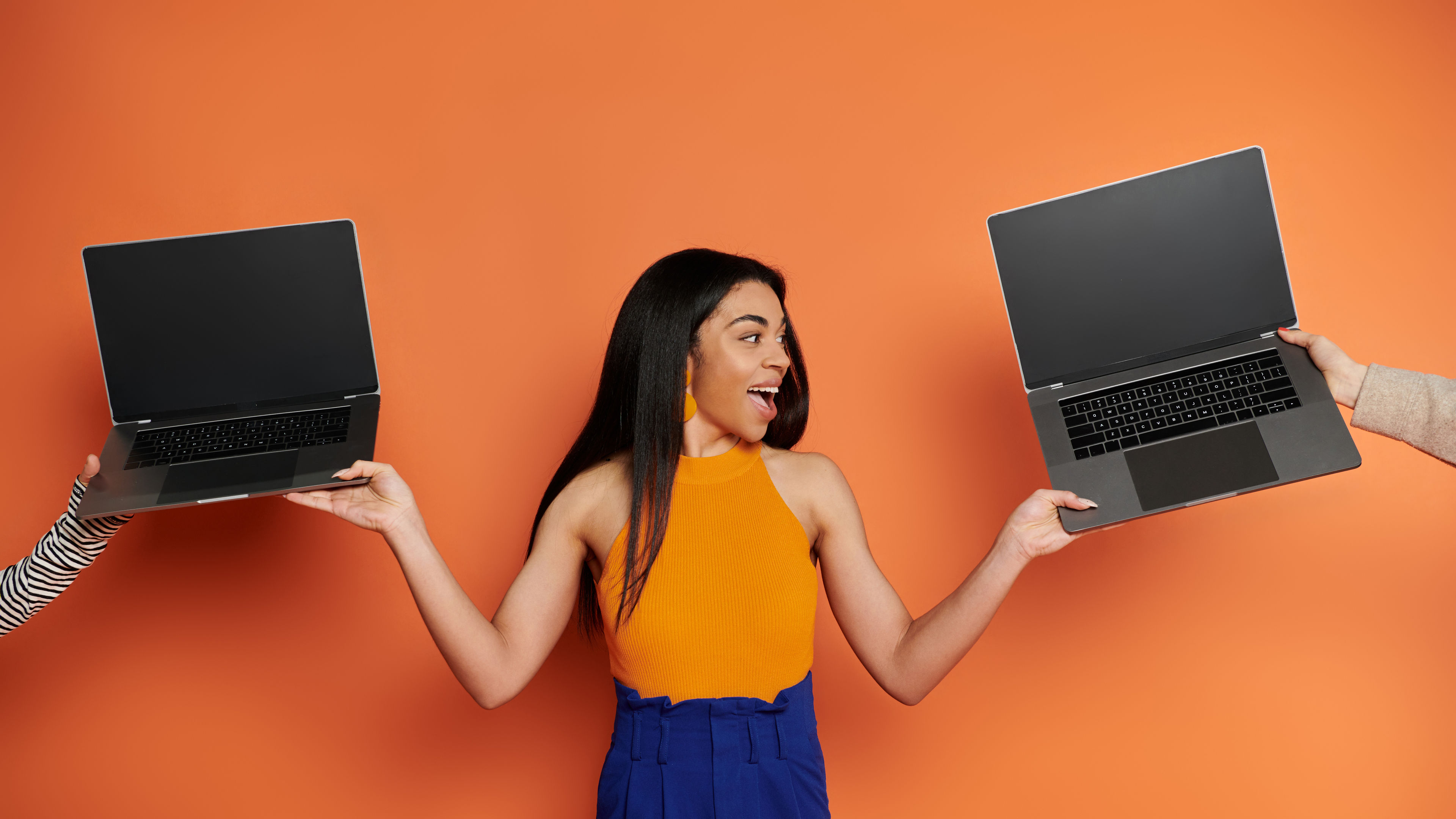 Woman Holds Laptops
