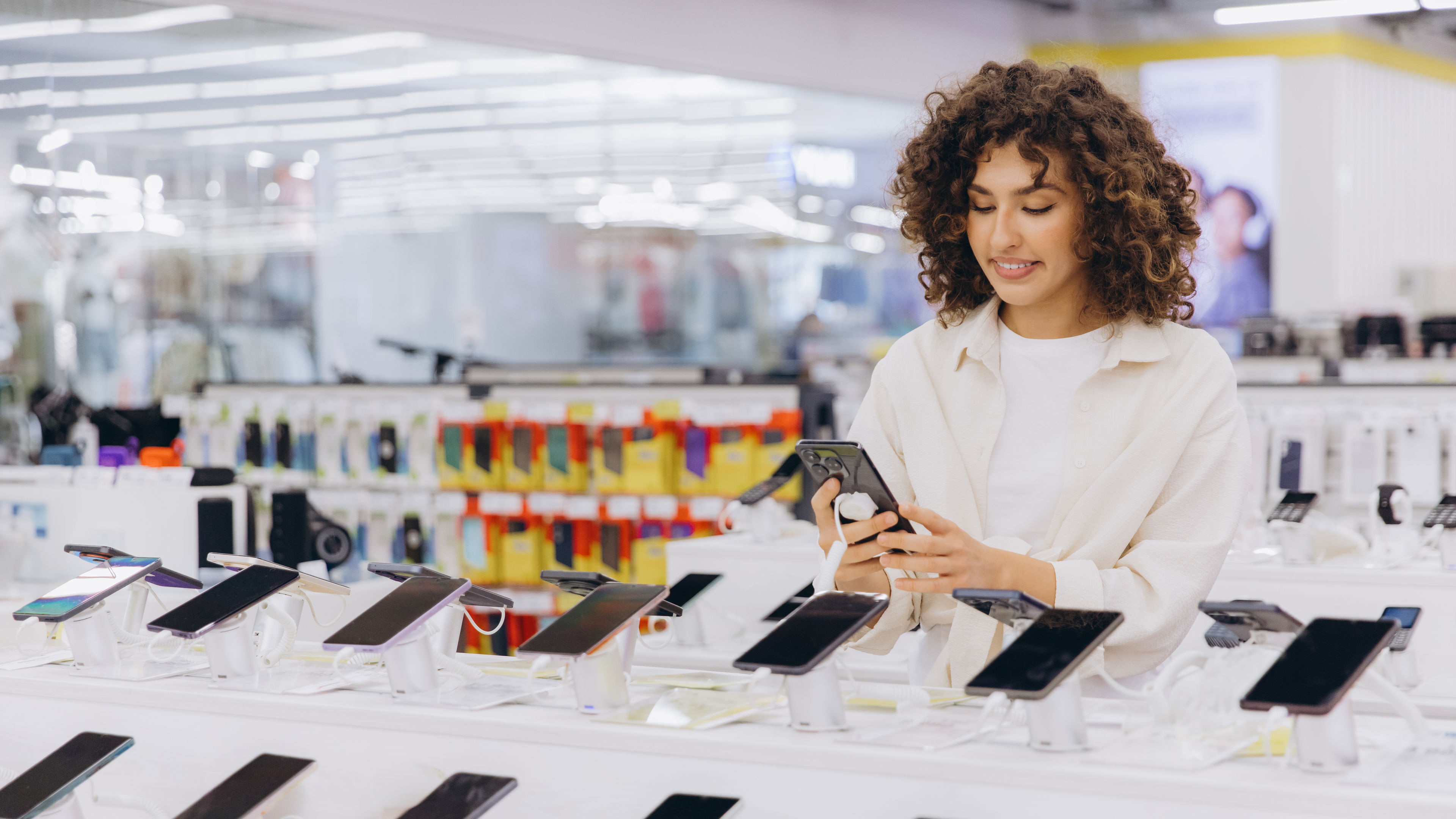 Woman Shopping for New Cell Phone