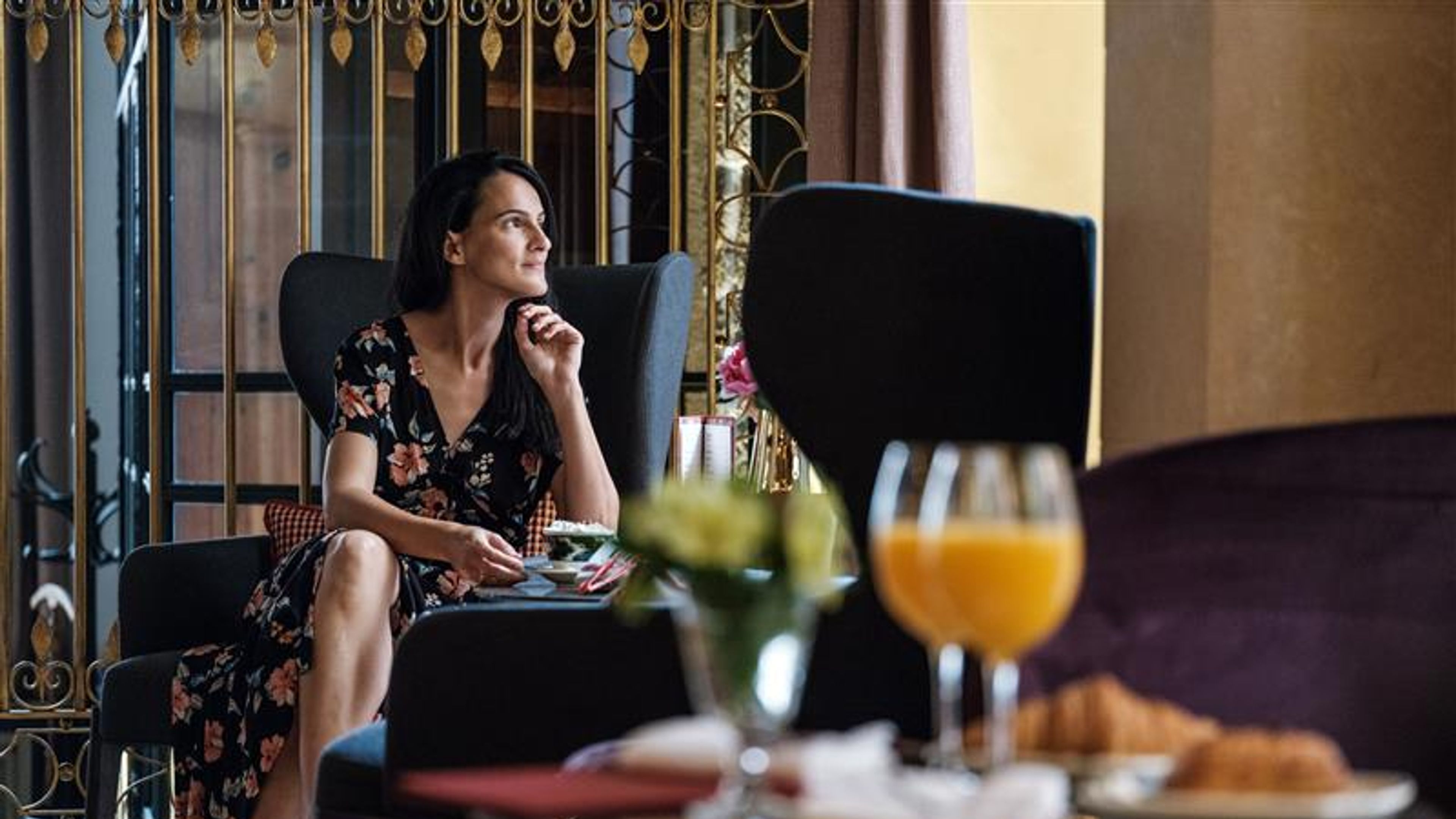 Woman having breakfast in luxury room