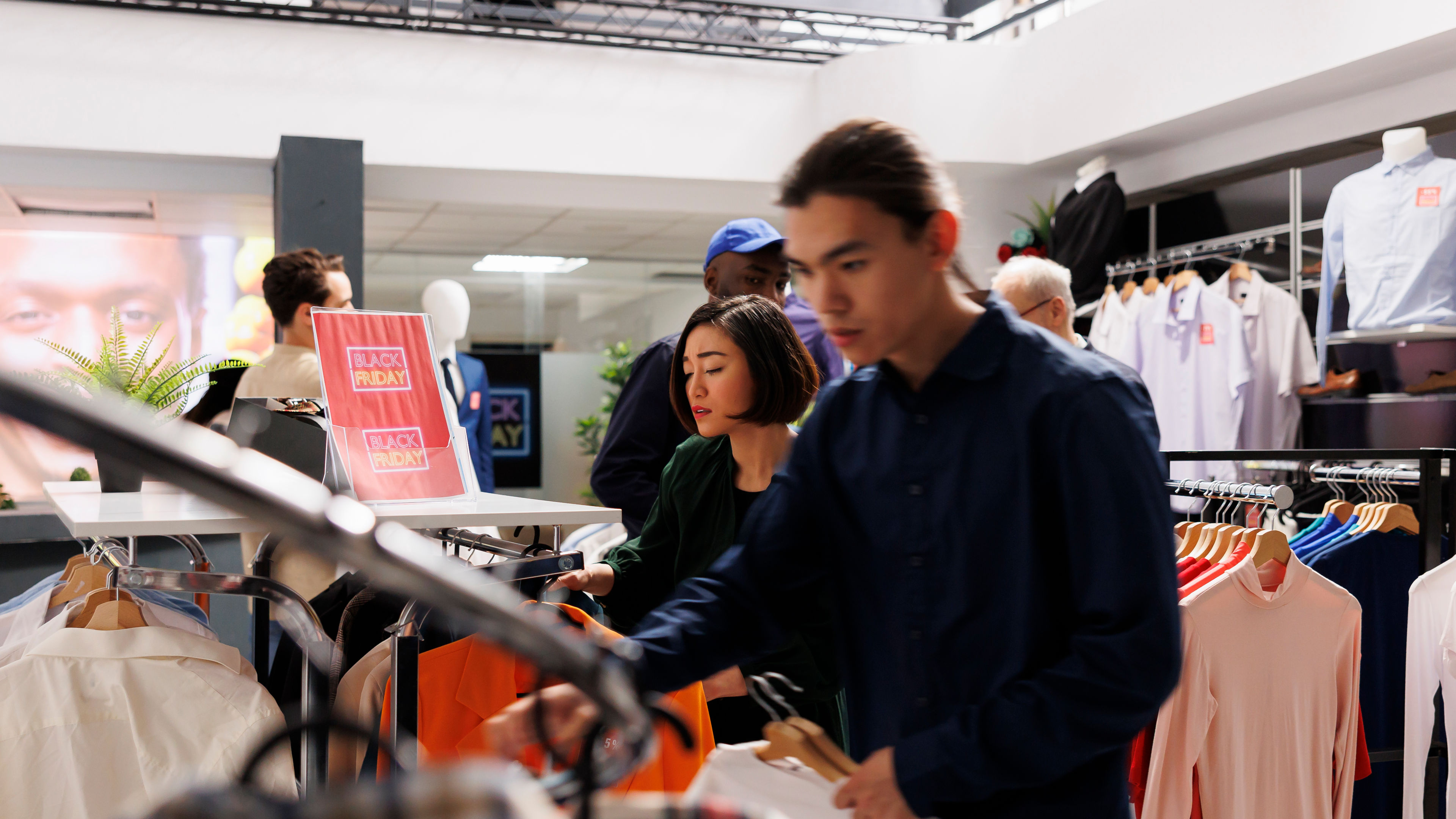Image of people shopping in a store for black friday 