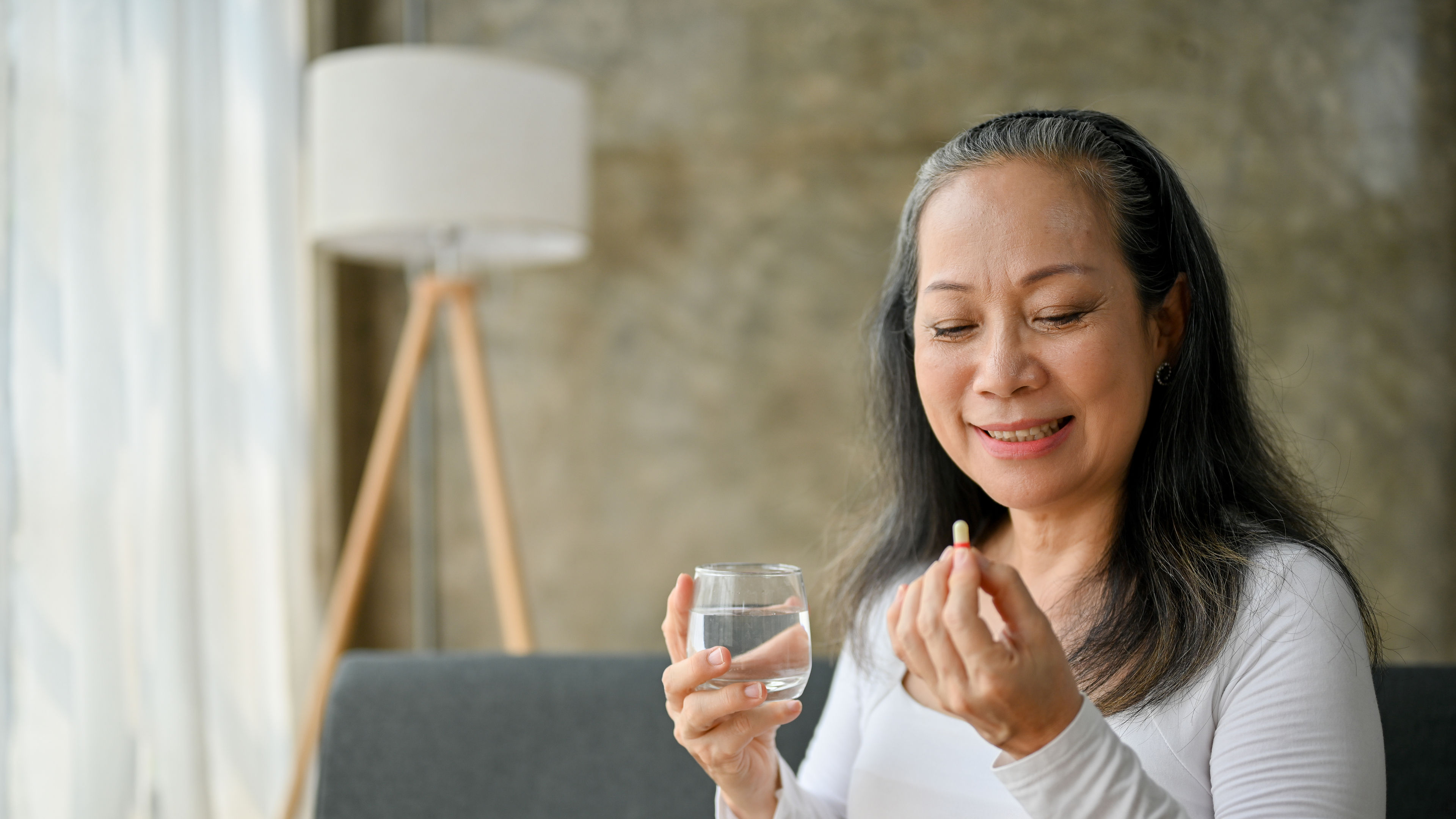 Woman eating pills