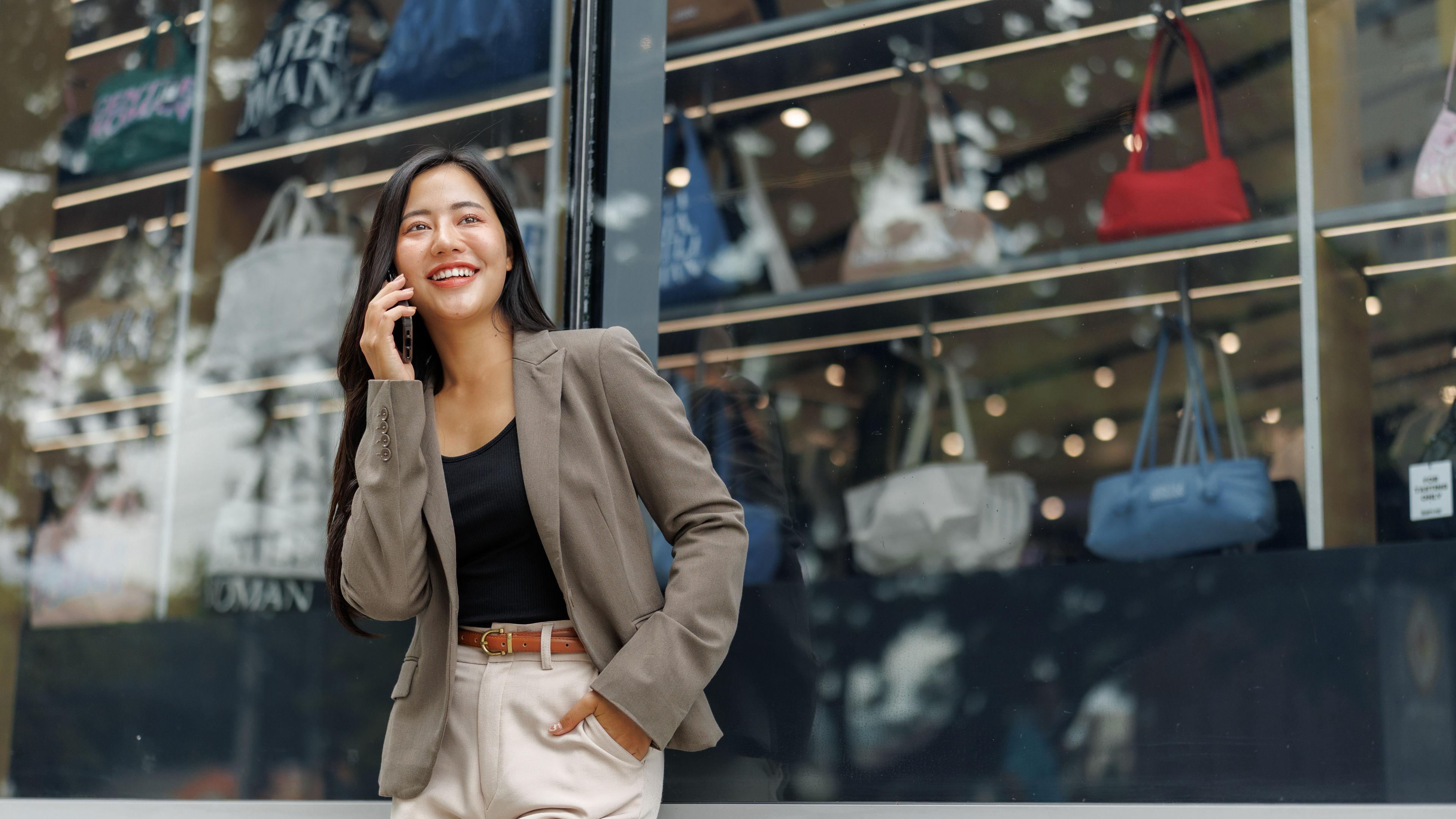 Woman standing near a clothing store