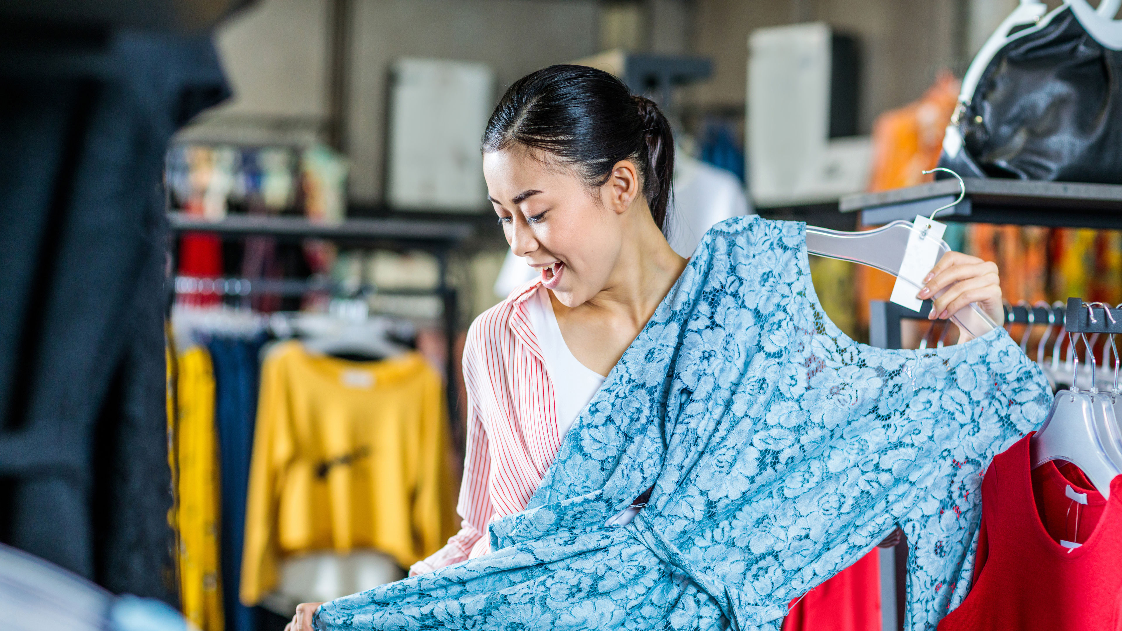 Woman trying clothes at store