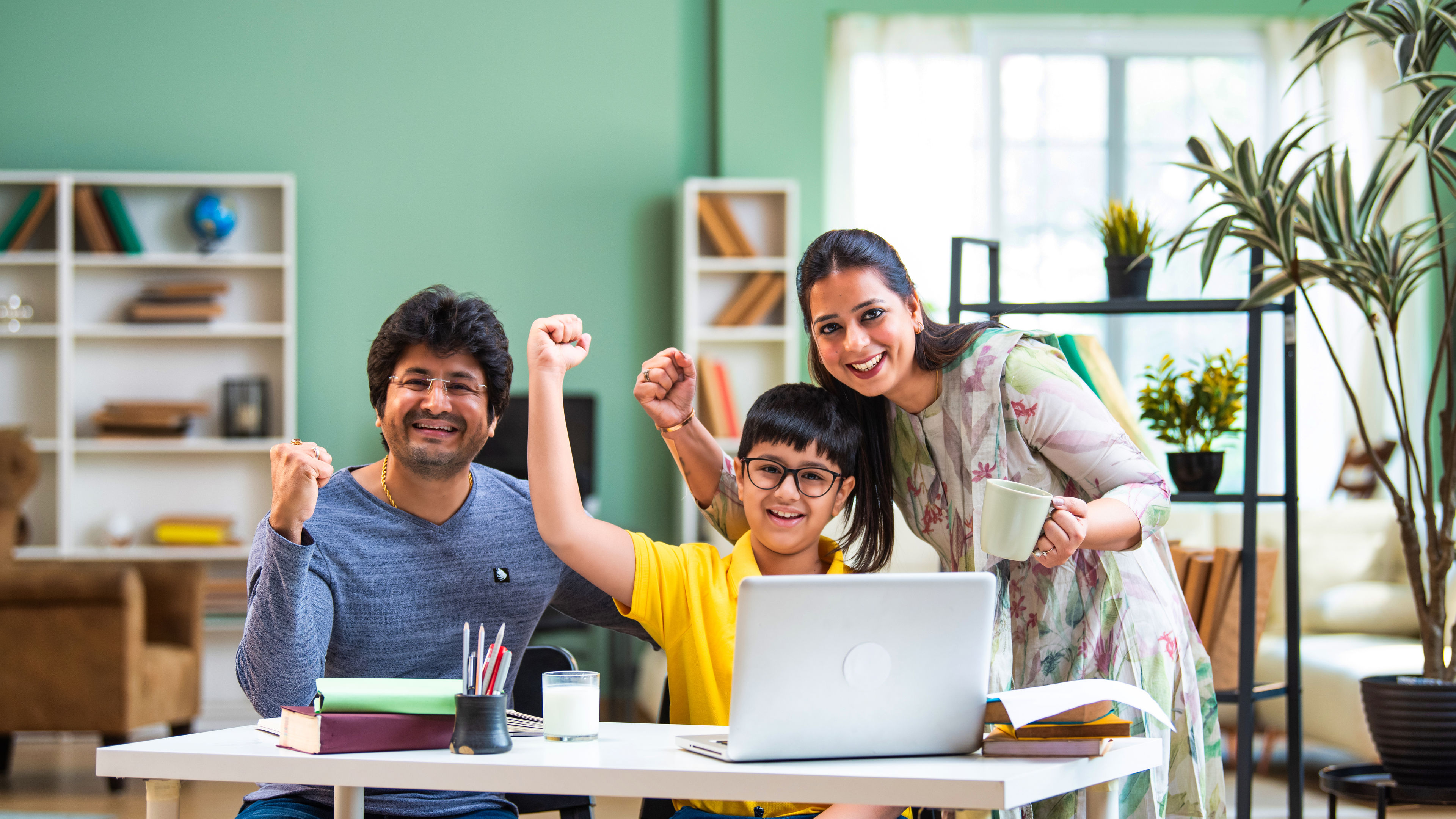 Family Cheering with Laptop 
