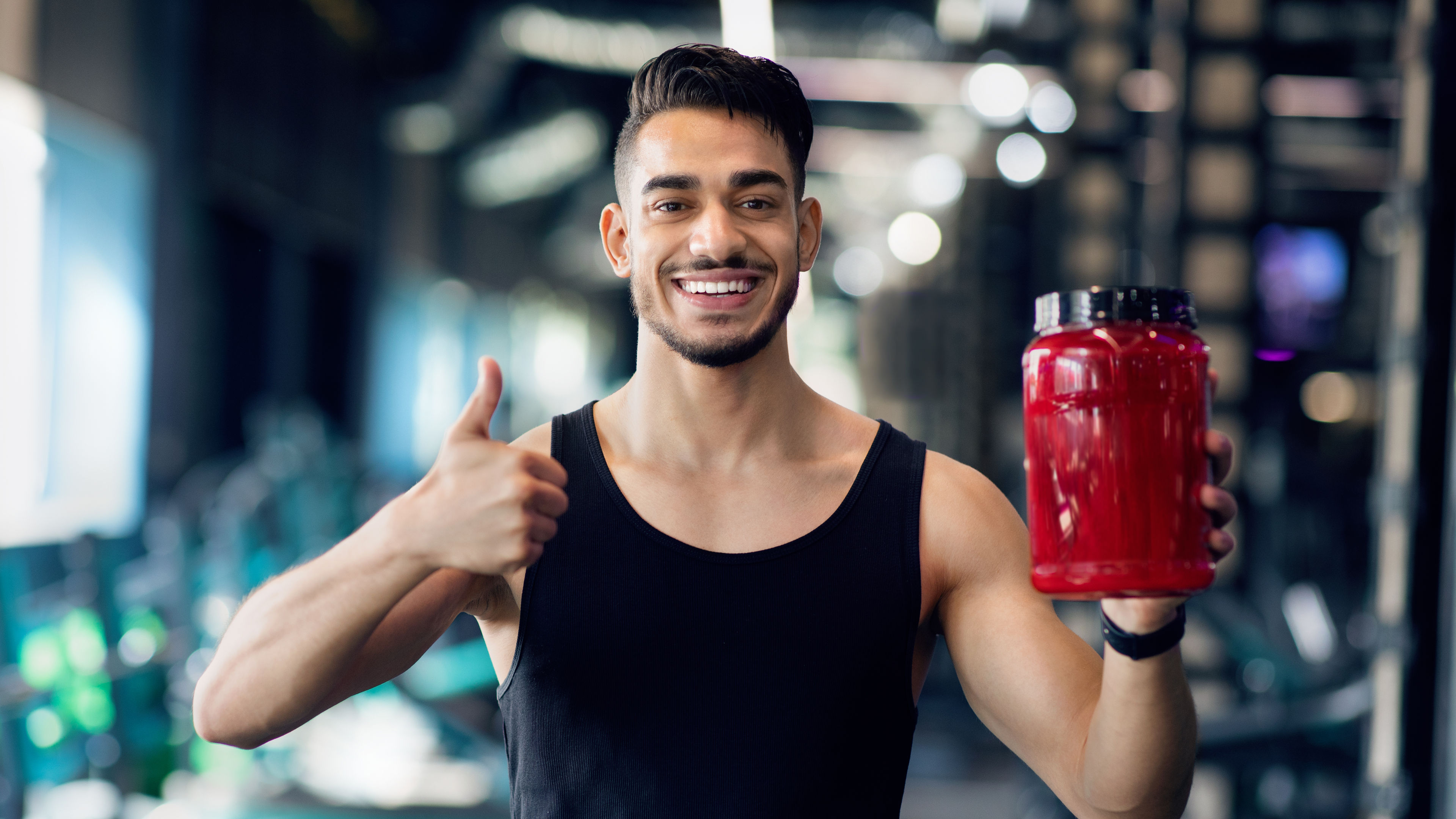 Man holding supplement bottle