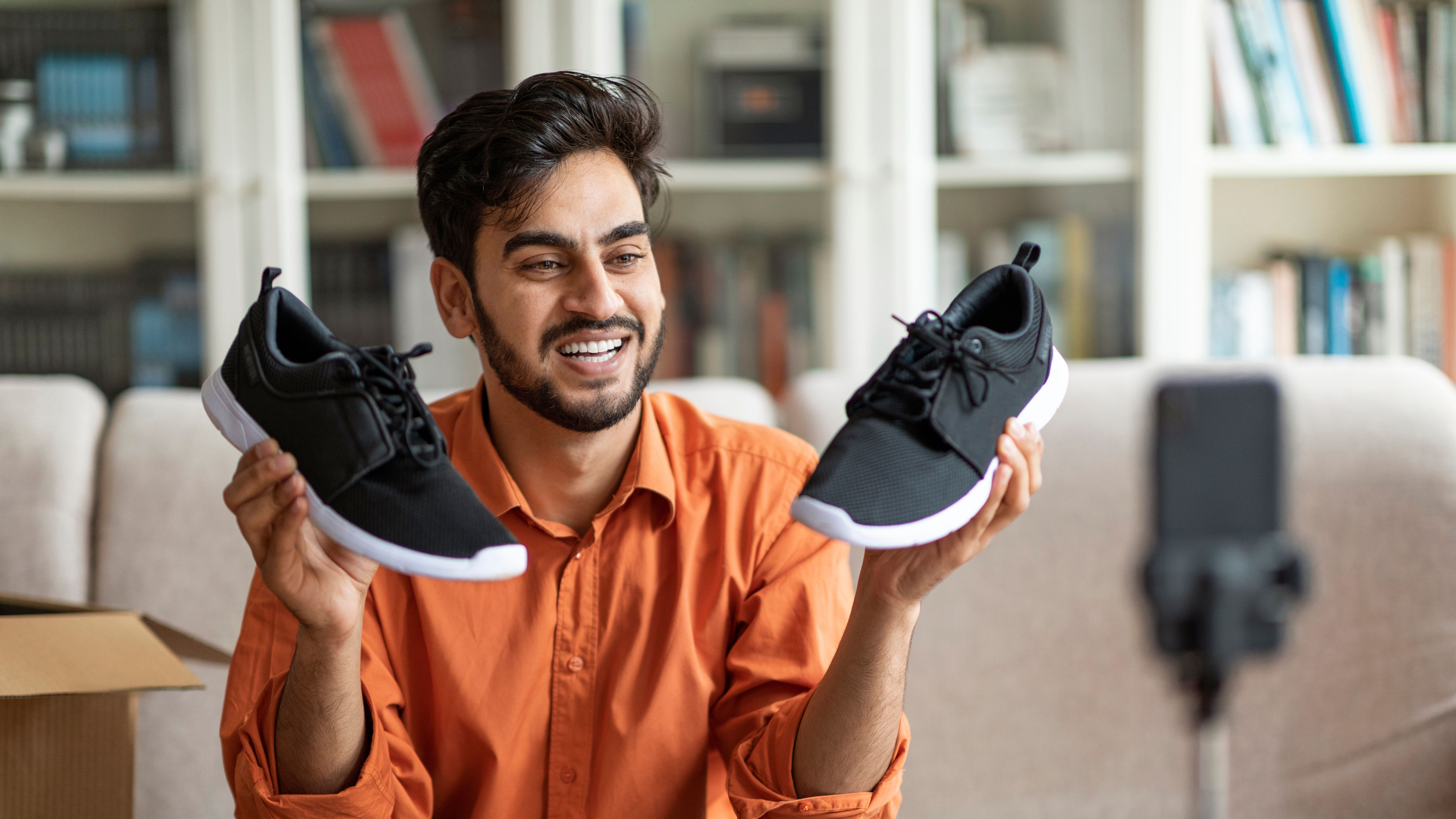 Man showing brand new sneakers