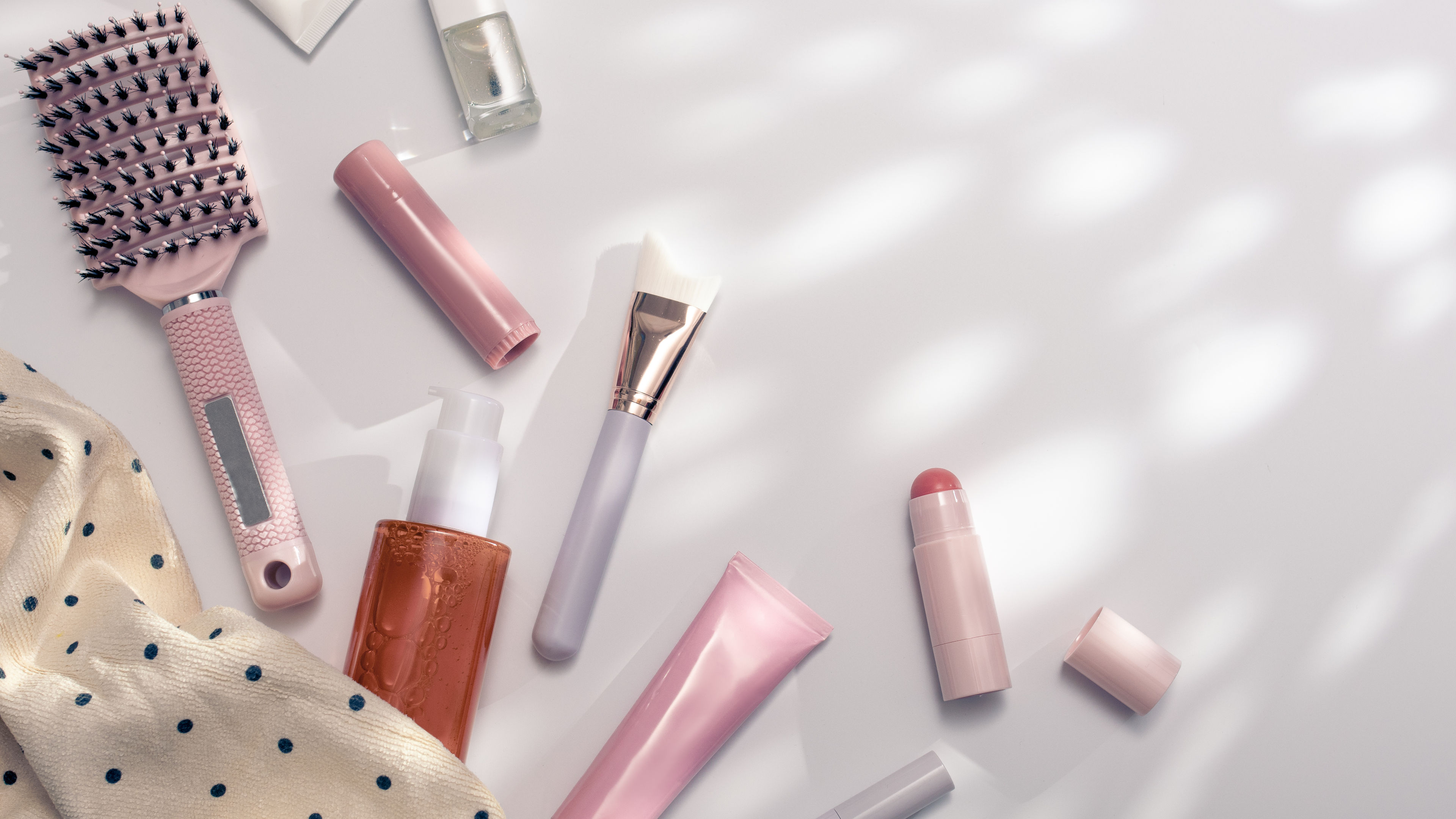 skincare bottles, brushes and makeup items