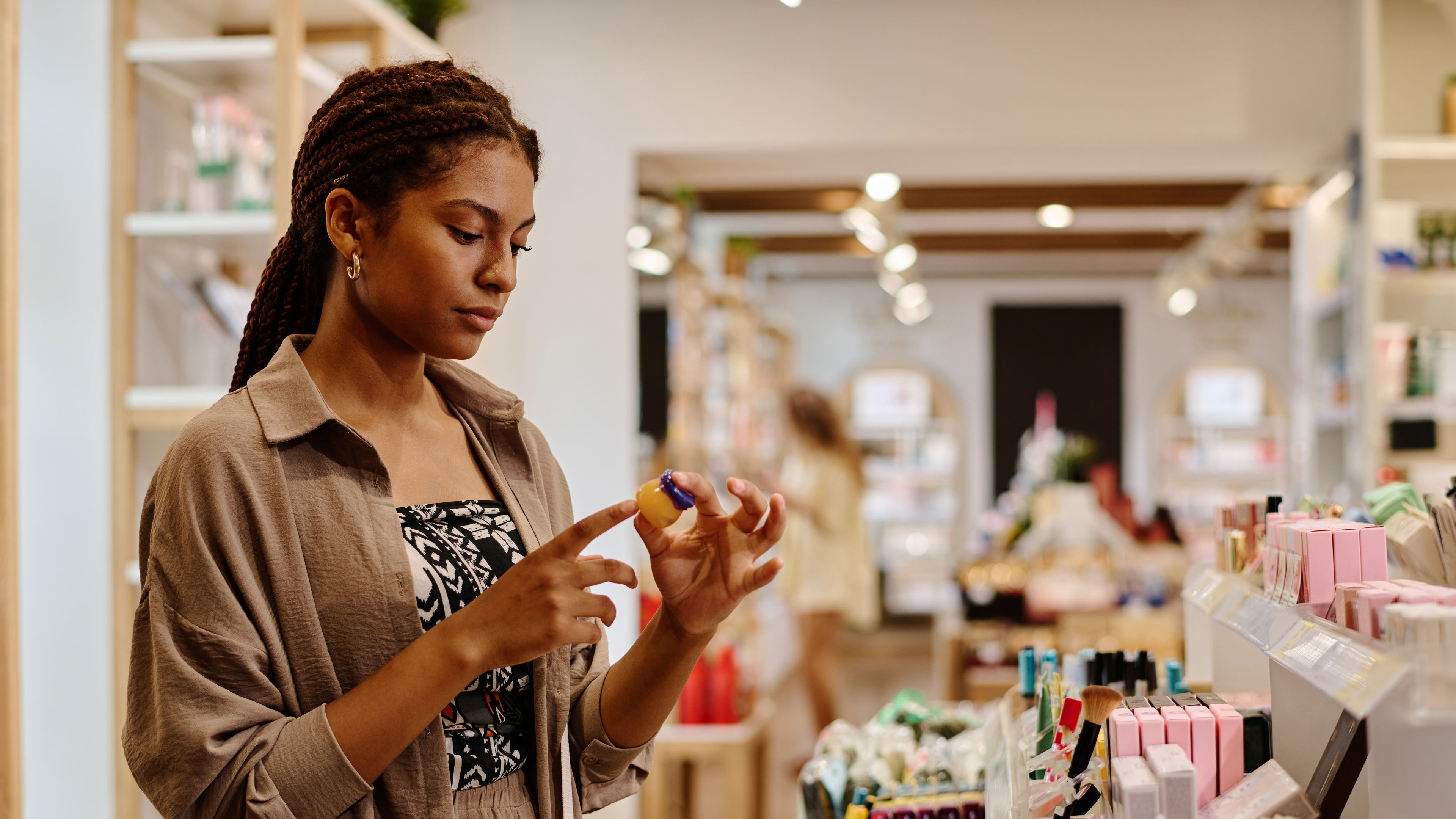 Woman buying lip balm