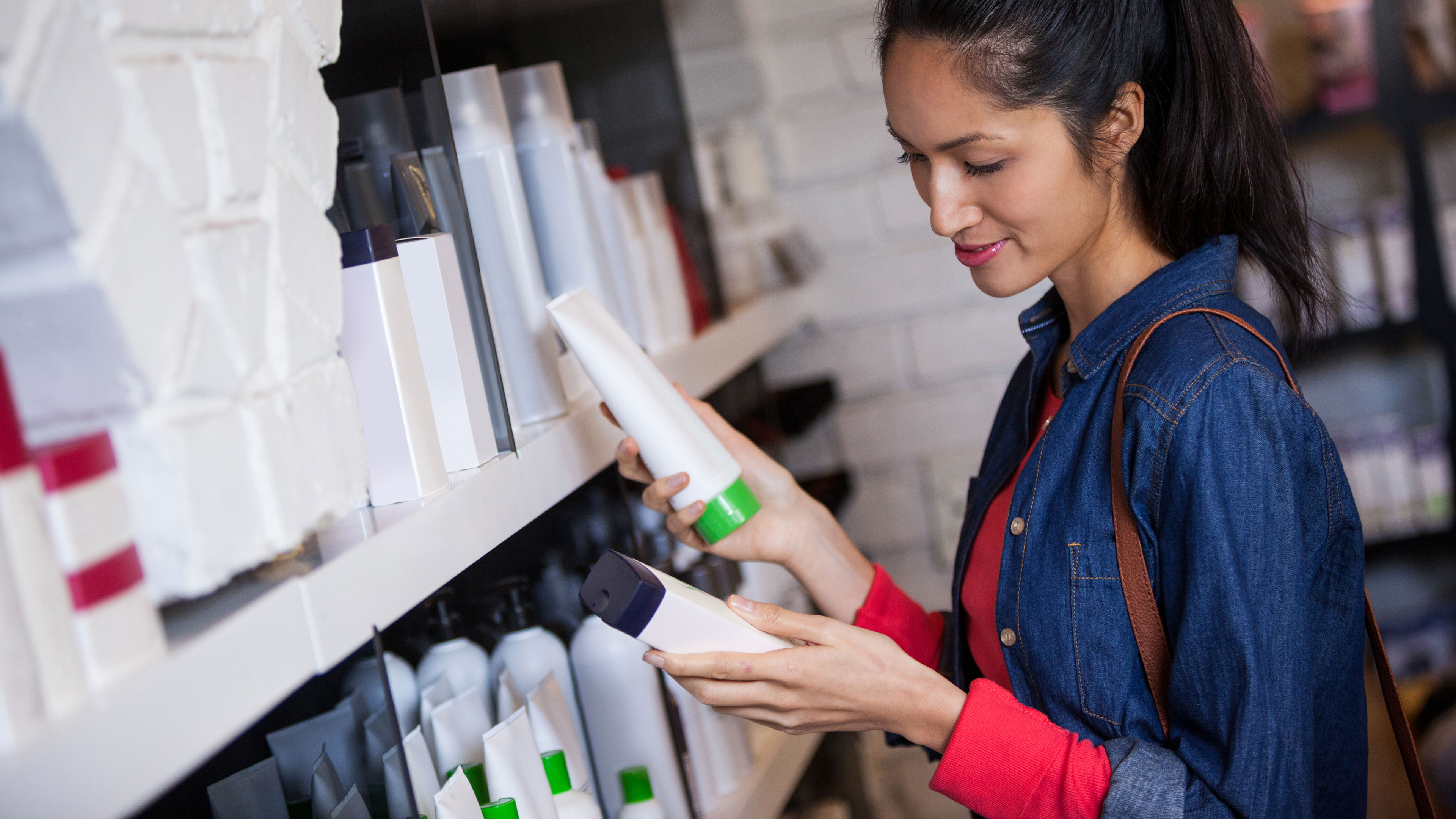 woman happily browsing beauty items