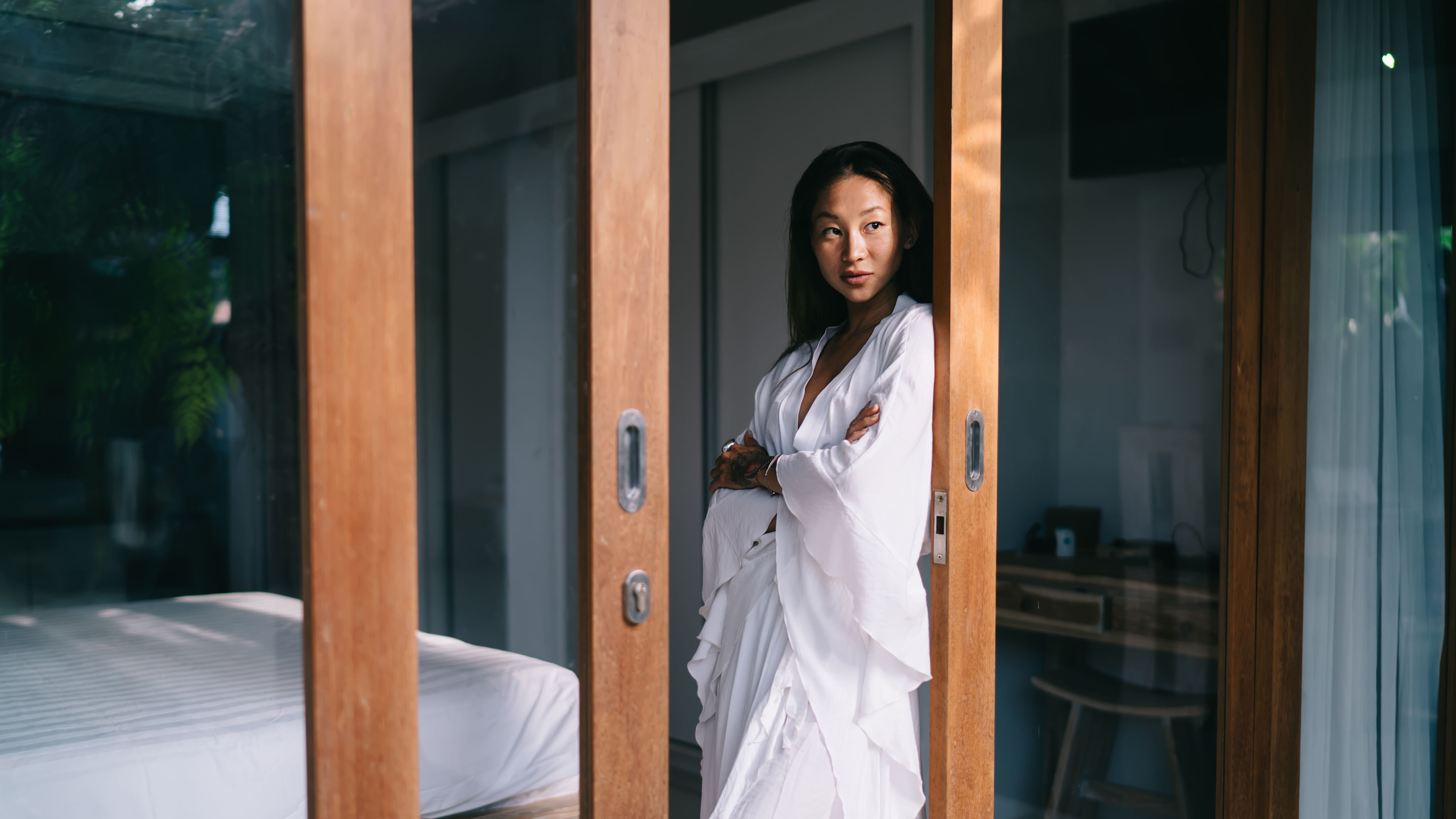Calm Asian woman resting in hotel