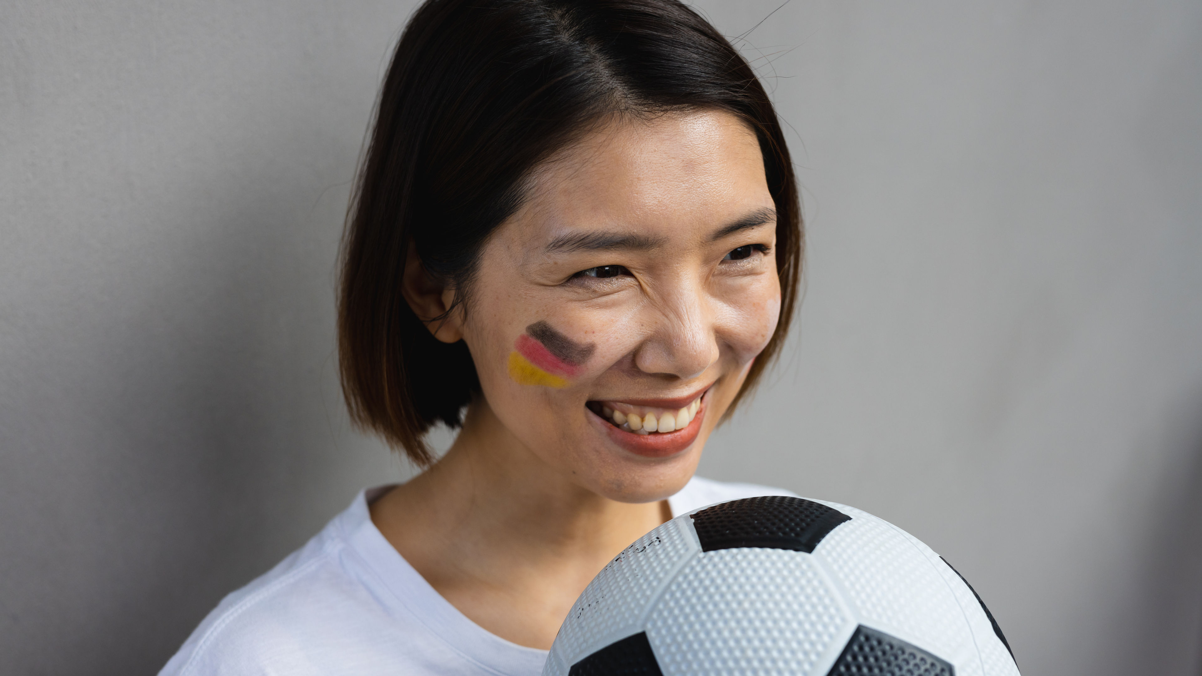 Woman holding football 