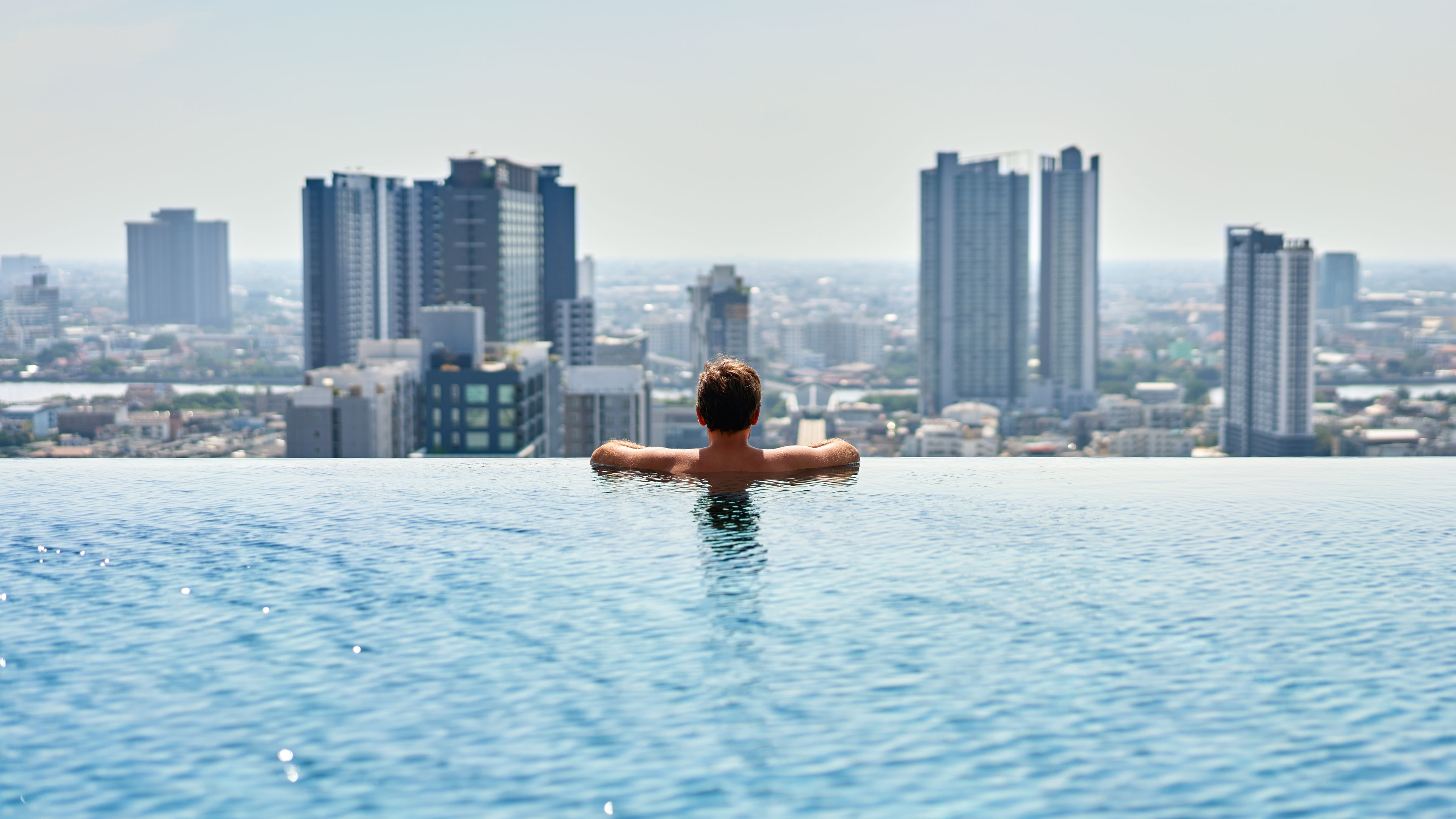 Young man relax on the swimming pool