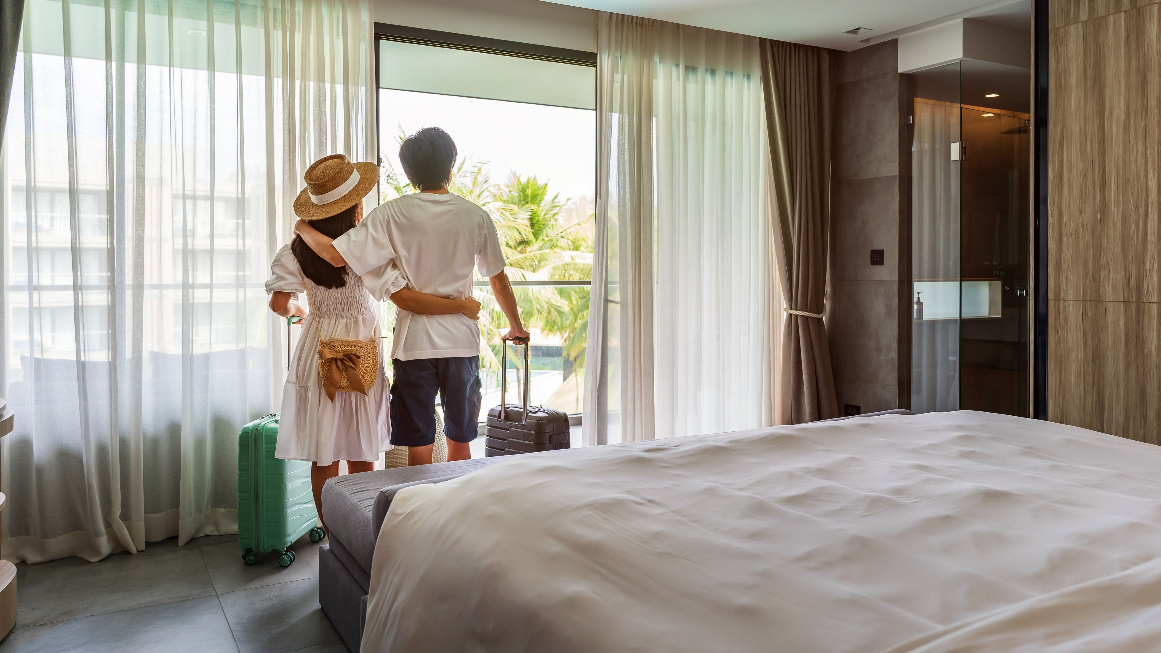 Couple standing near the curtain