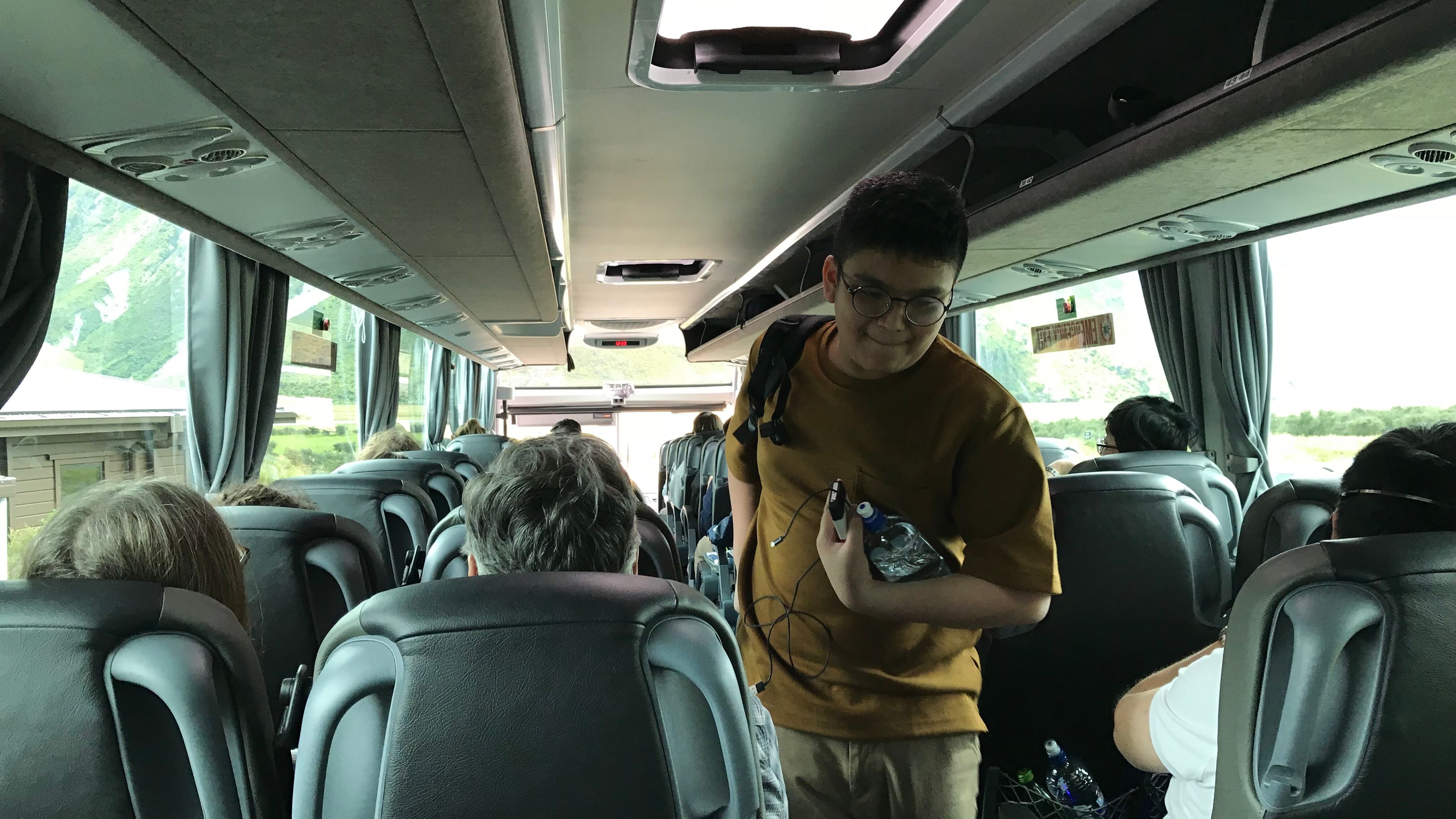 Group of people inside a modern tour bus