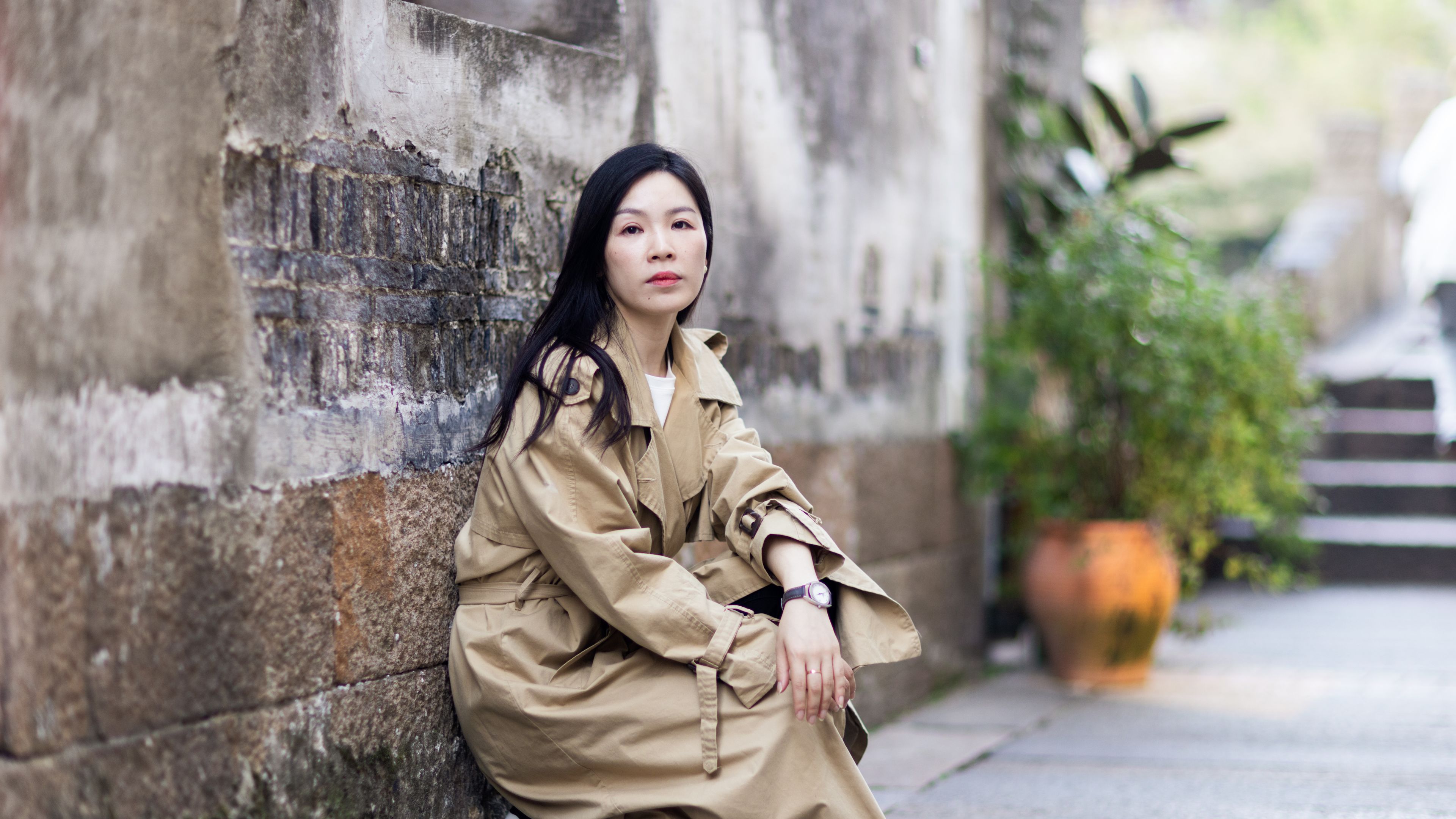 Lifestyle portrait of a pretty young Asian woman with a charming smile. 