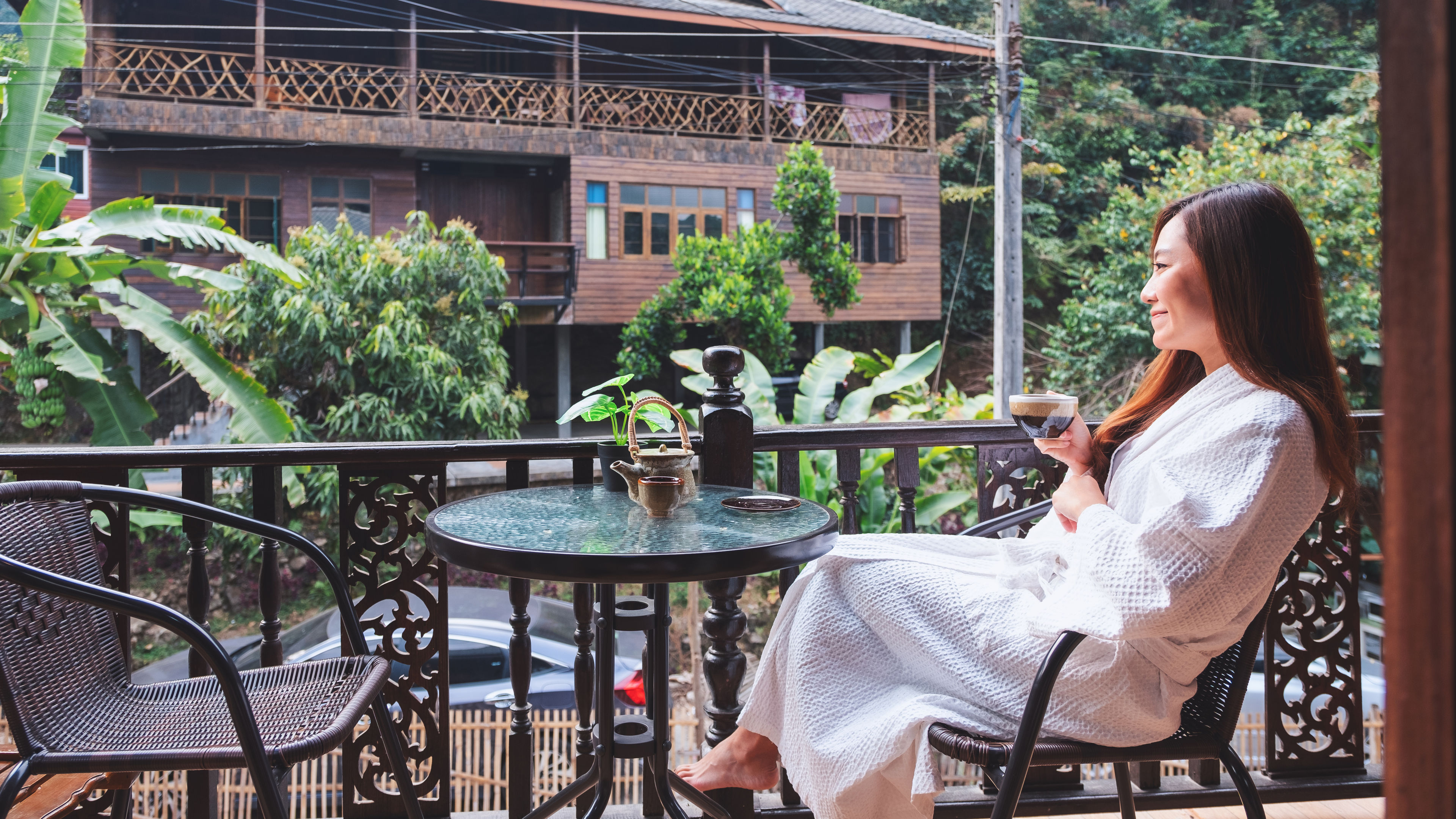 Woman holding cup and enjoying view