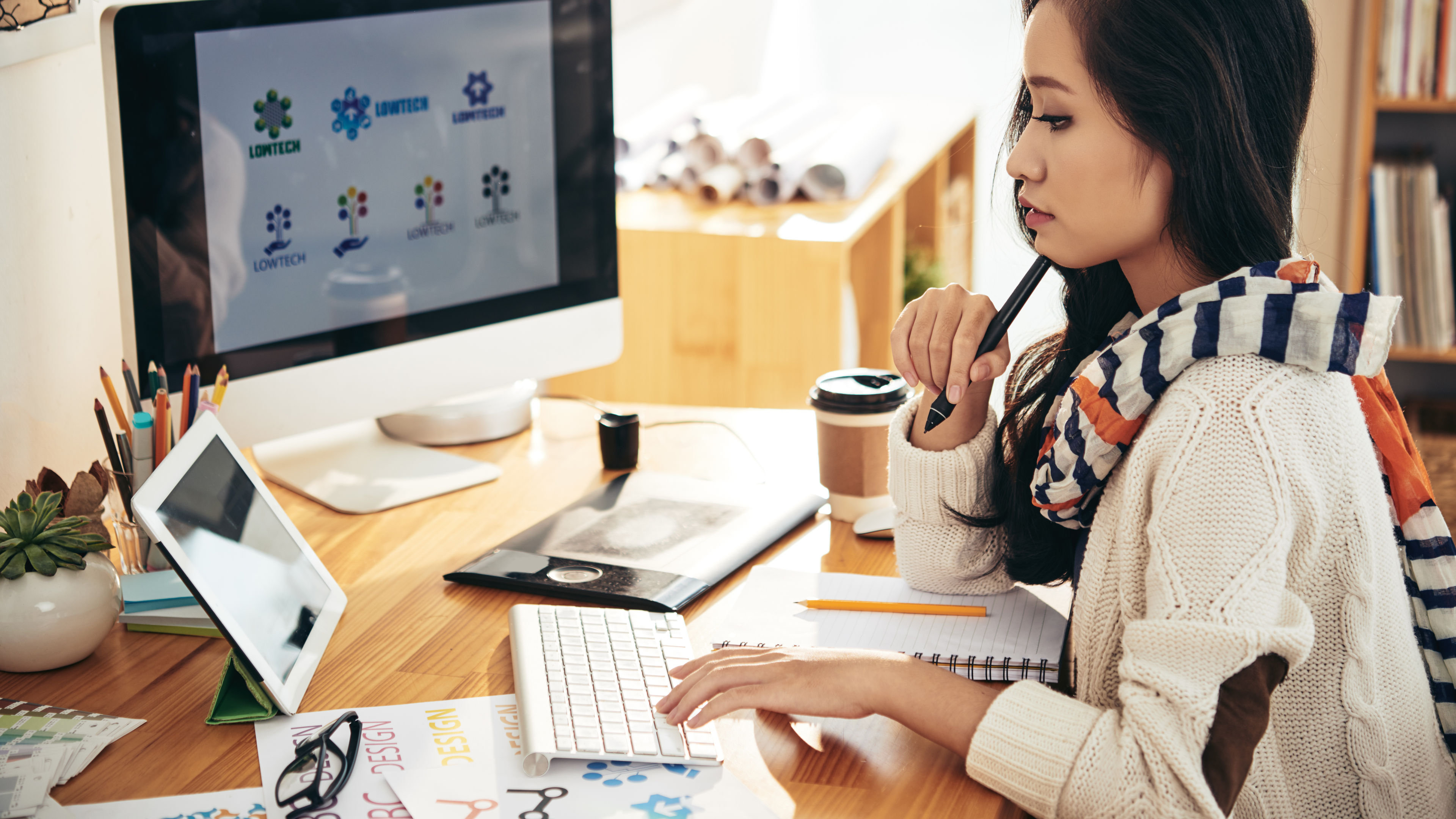 An engaging visual of a team or individual concentrating on an important project, surrounded by tools and materials that highlight a creative or productive workspace. 