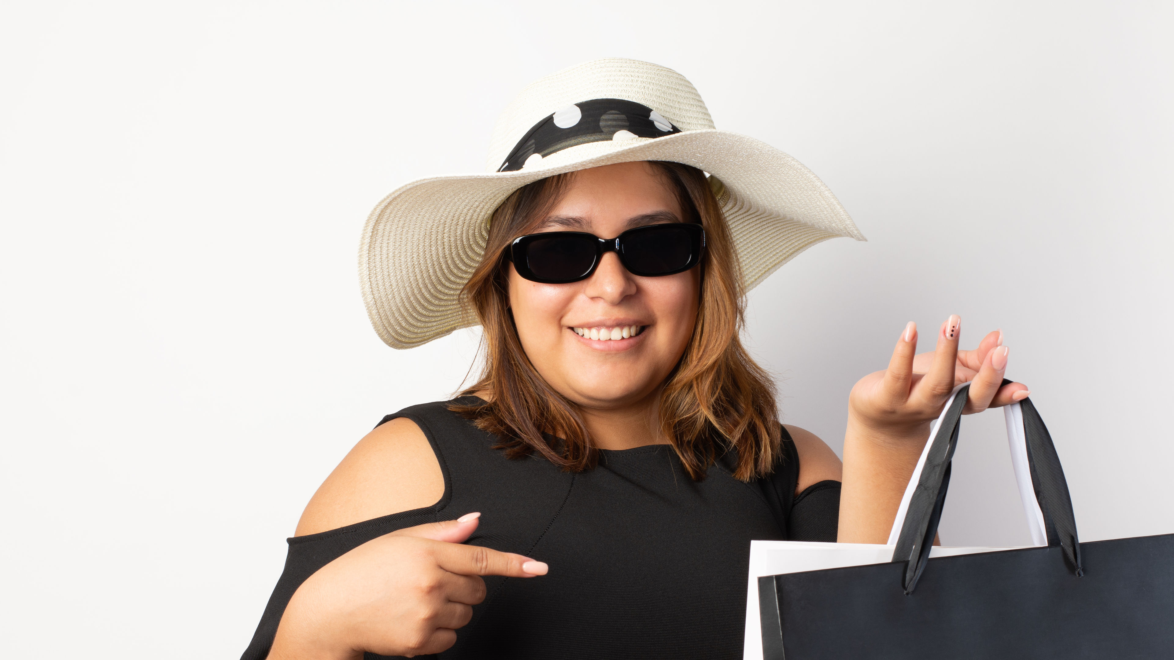 Image of a Cheerful Hispanic woman is enjoying shopping on a Black Friday 
