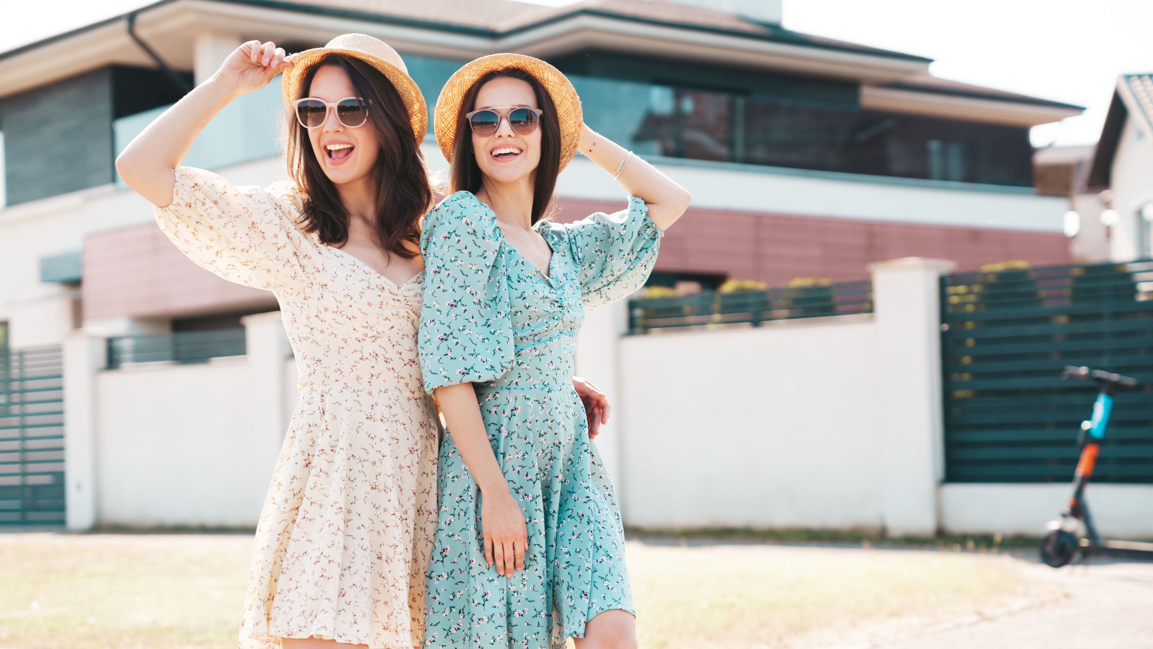 Happy Young Women in Floral Dresses