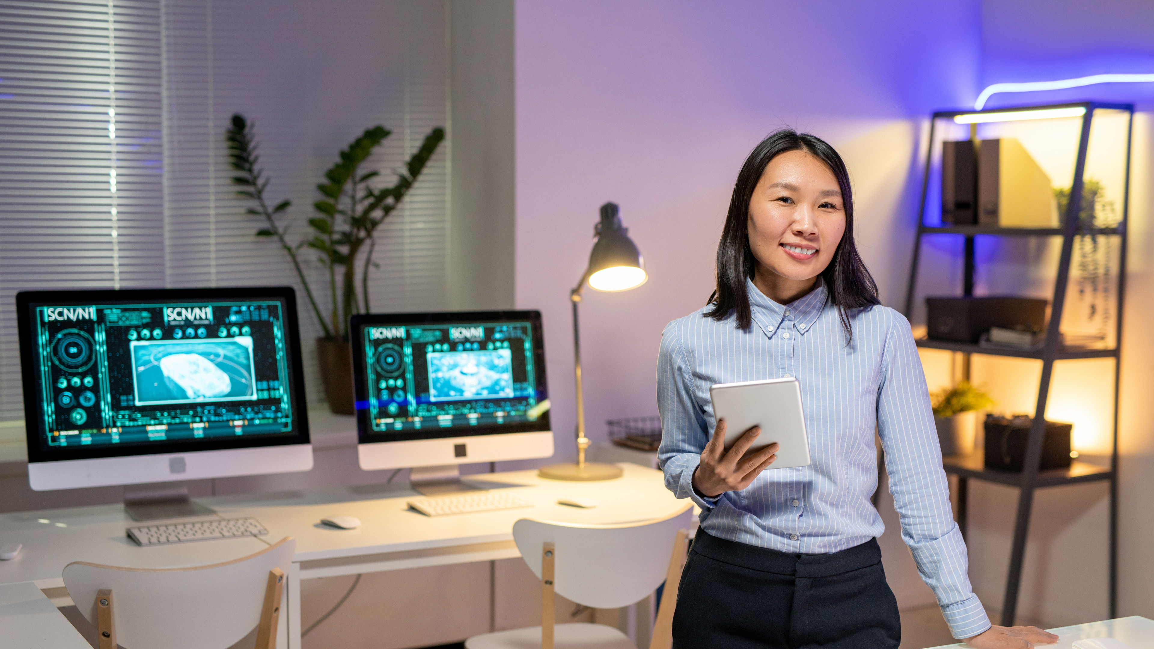 Portrait of attractive Asian car designer in office 