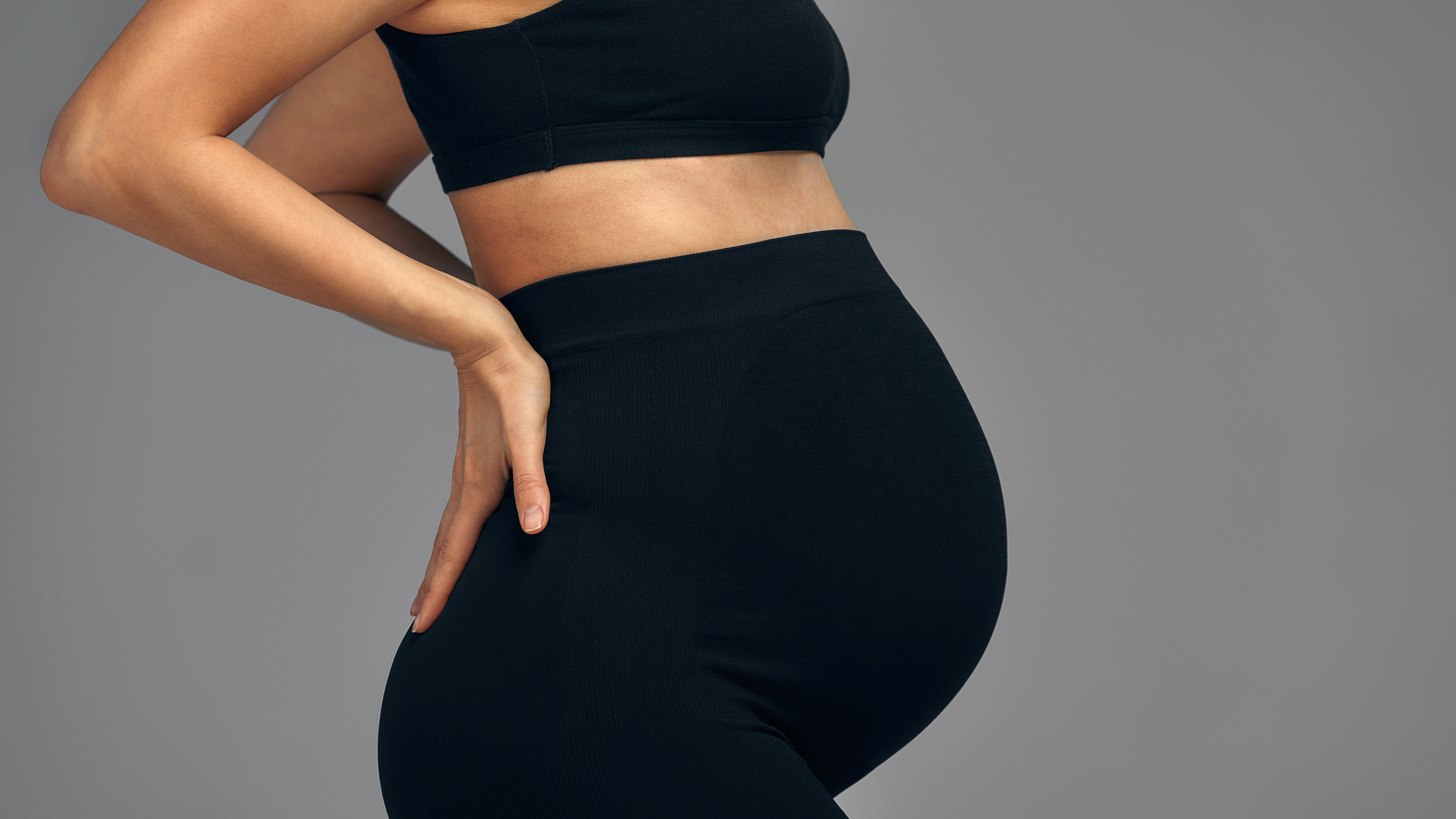 Pregnant lady in black biker shorts