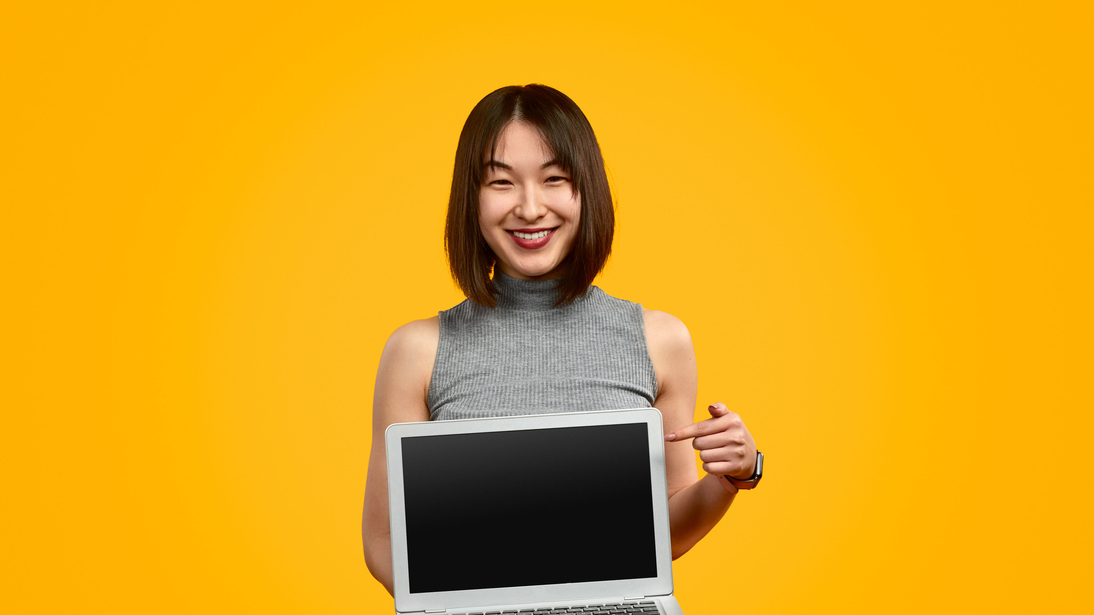 Woman holding laptop 