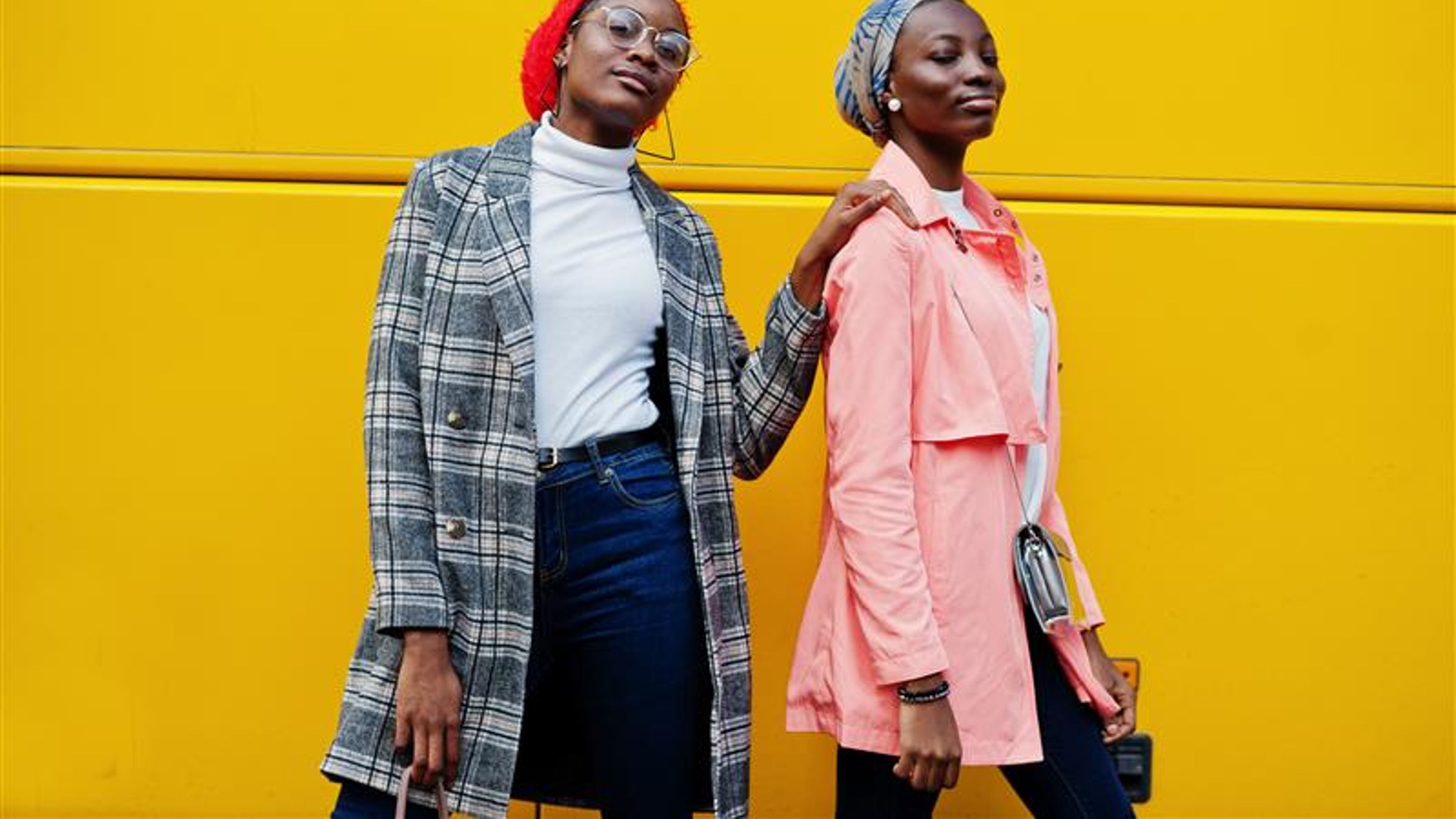 Two young modern fashionable, attractive, tall and slim african womans