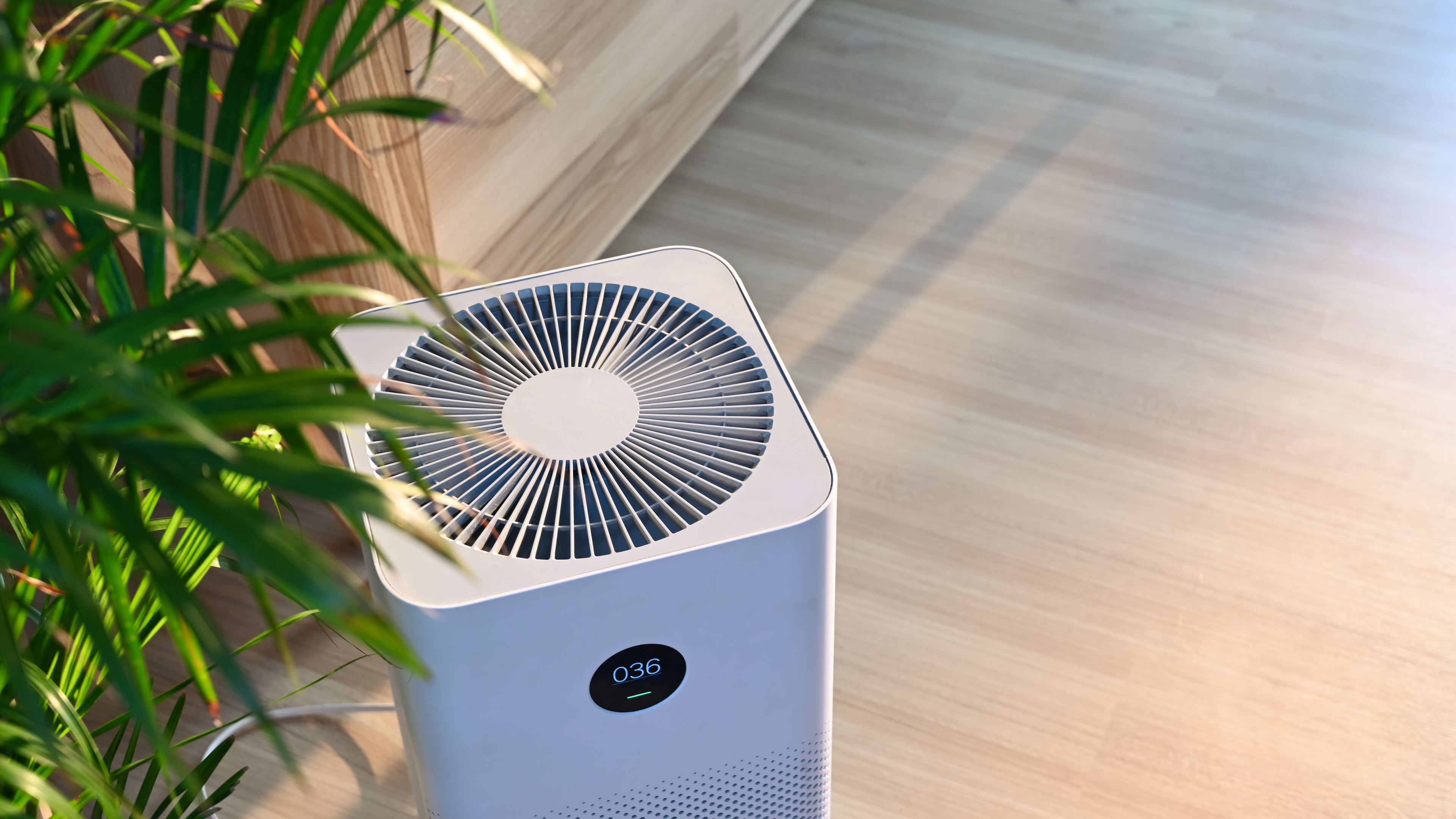Air purifier on wooden floor in comfortable home.