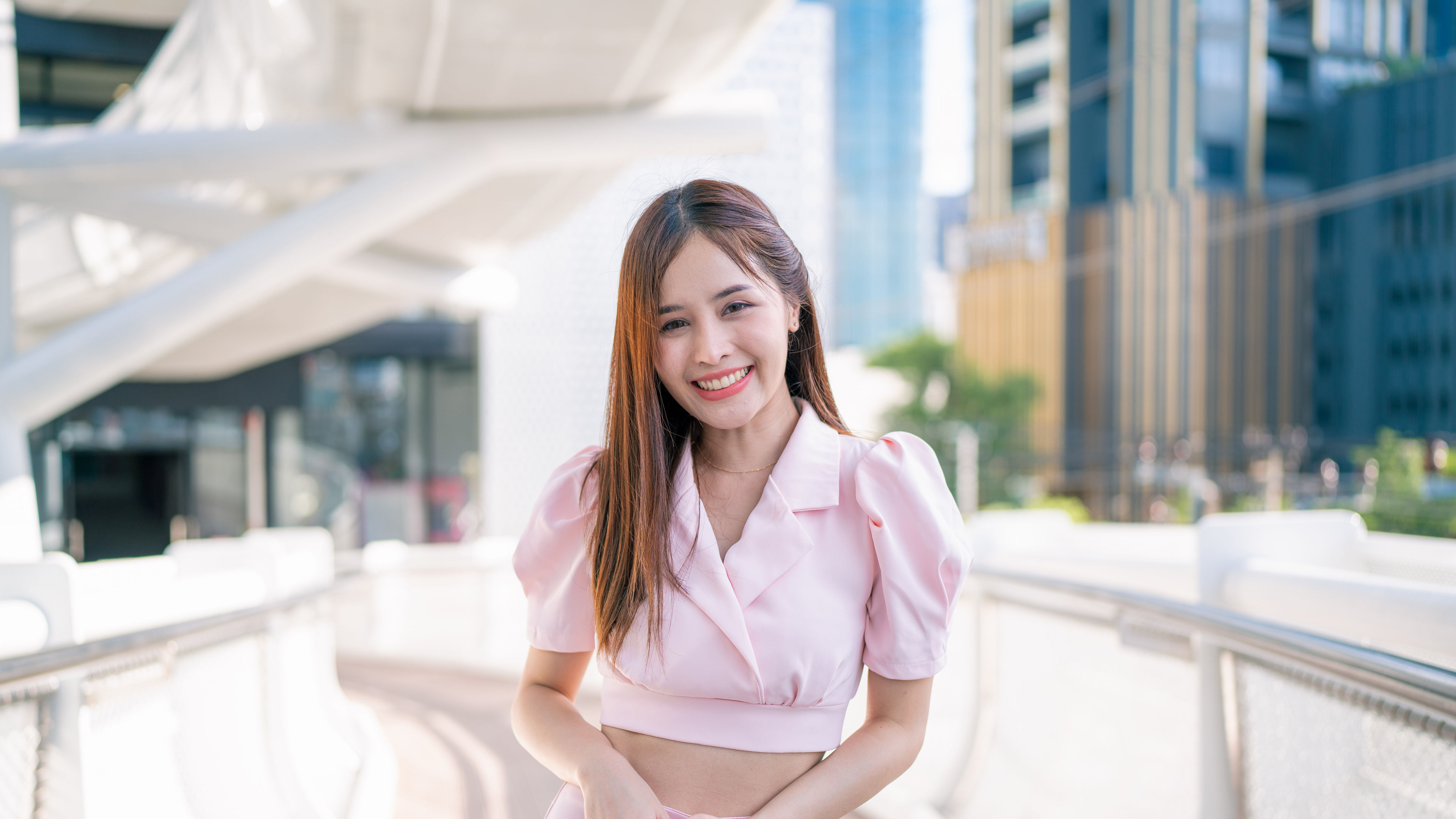 Portrait beautiful young asian woman smile happy and feel free with outdoor background for freedom concept 