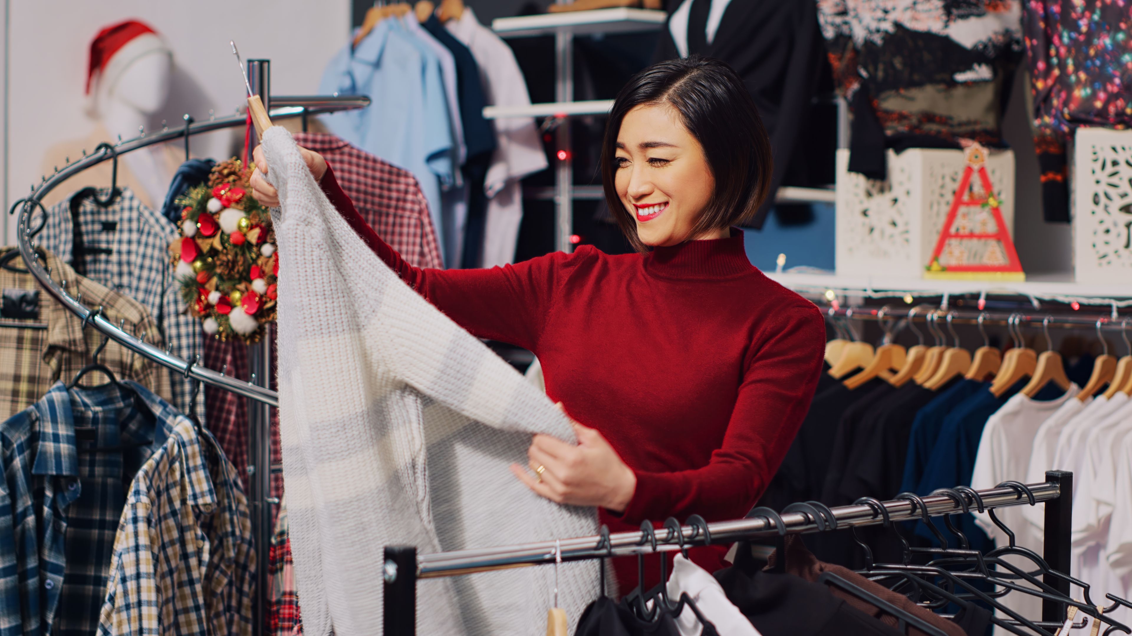 Smiling woman shopping for clothes
