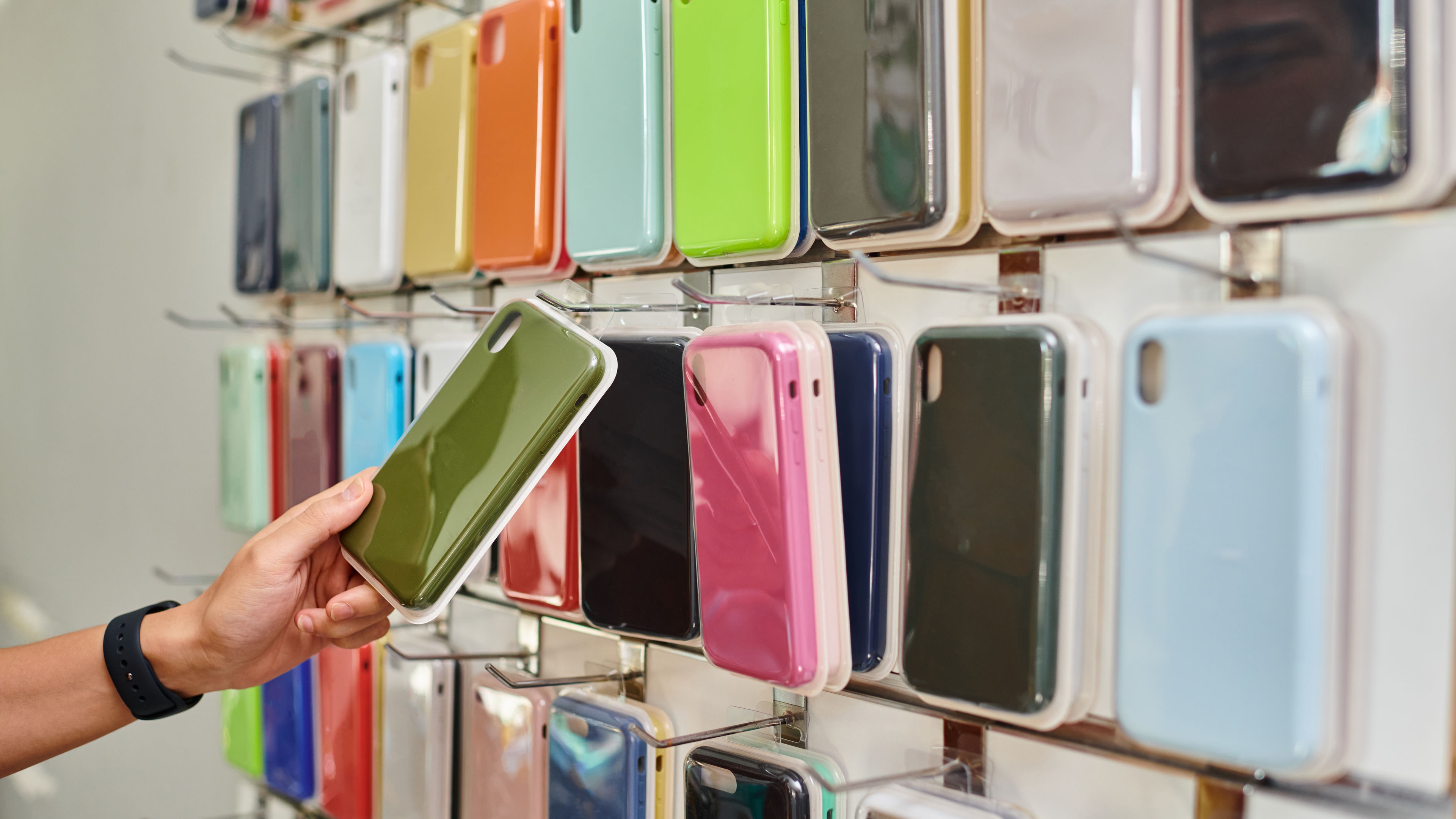 Some colourful mobile back covers in a mobile shop 