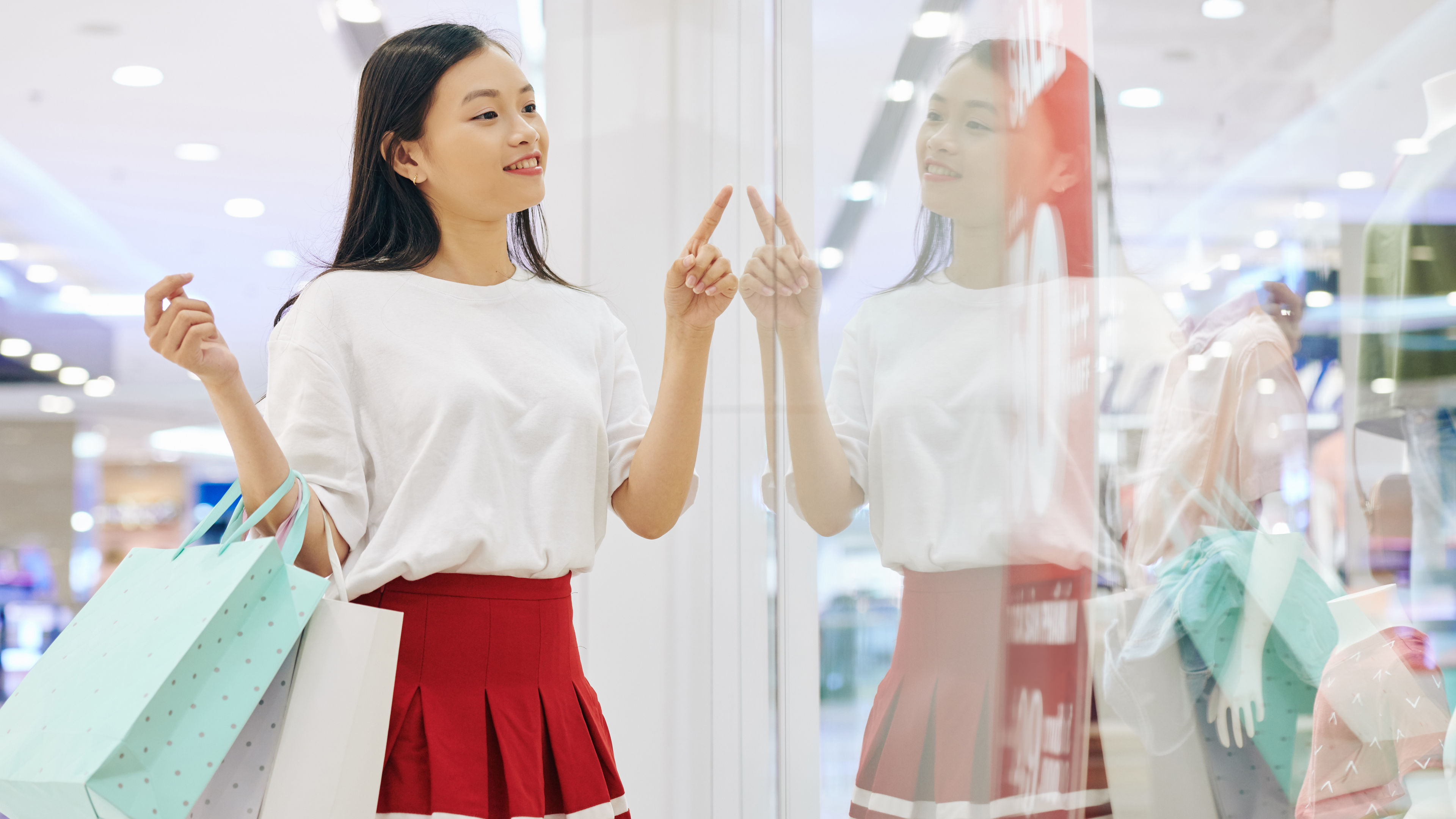A young woman is shopping in a mall