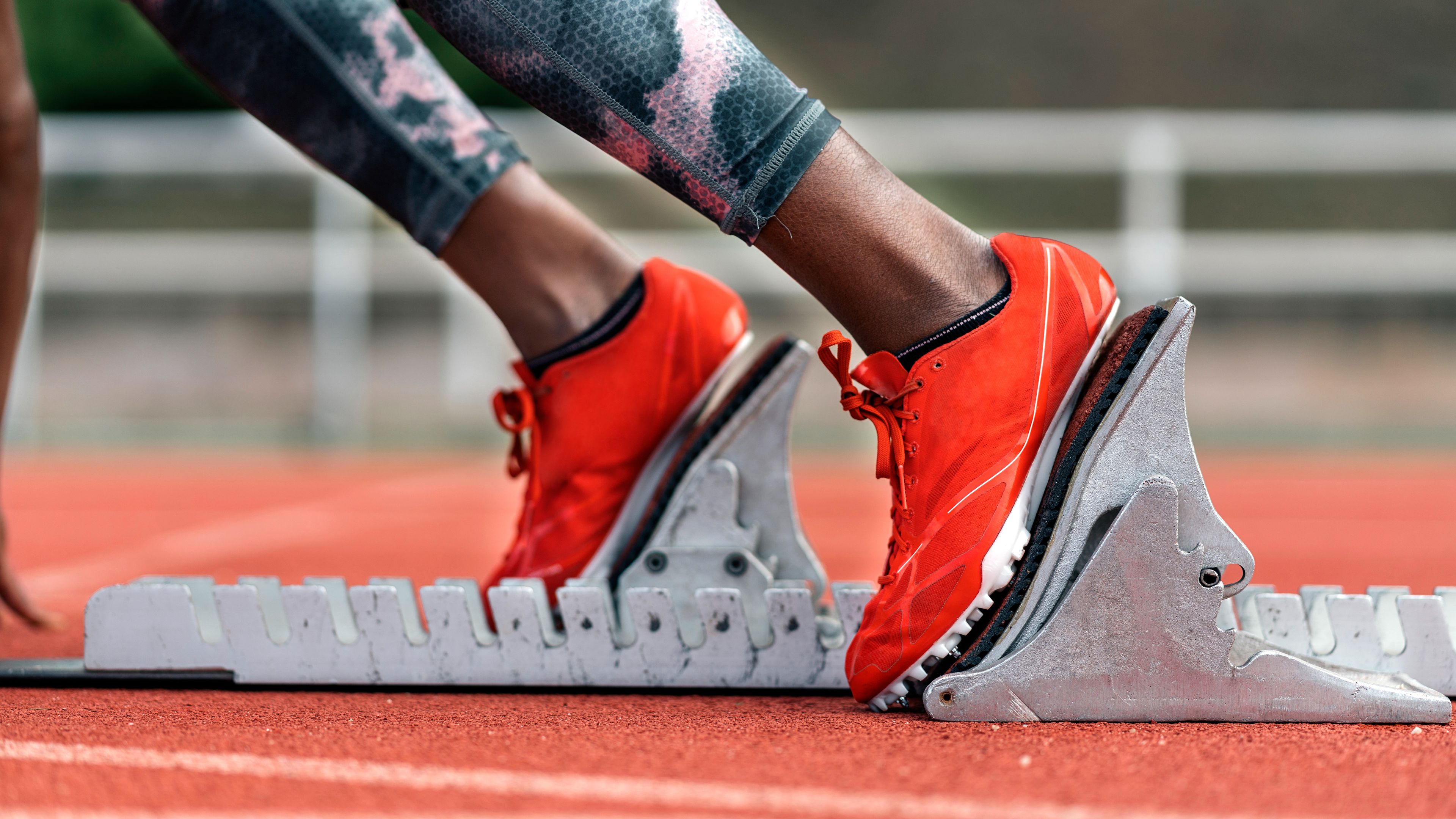 Athlete sprinter in starting position