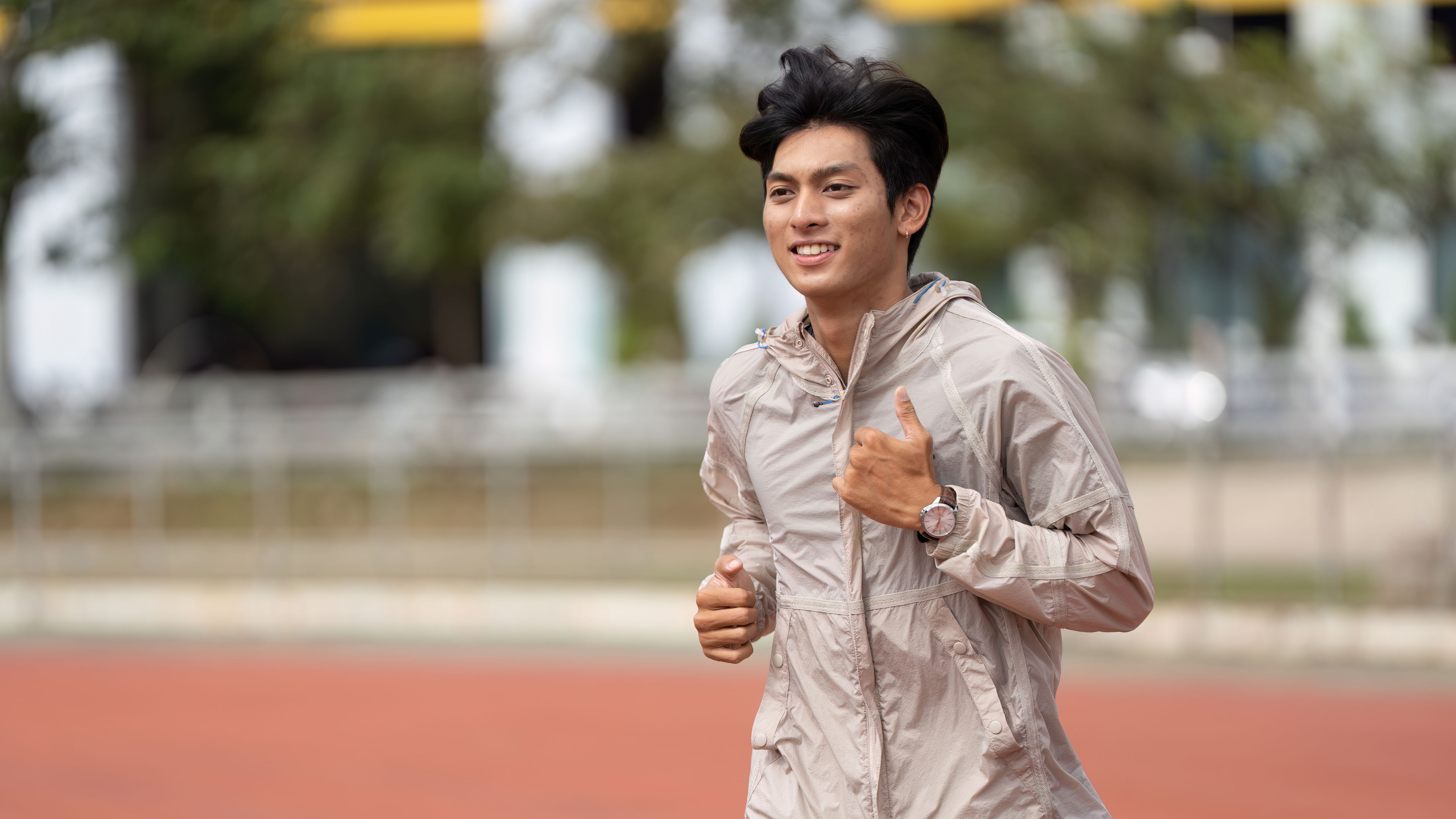 Energetic young man jogging outdoors in sportswear for a healthy lifestyle and fitness routine