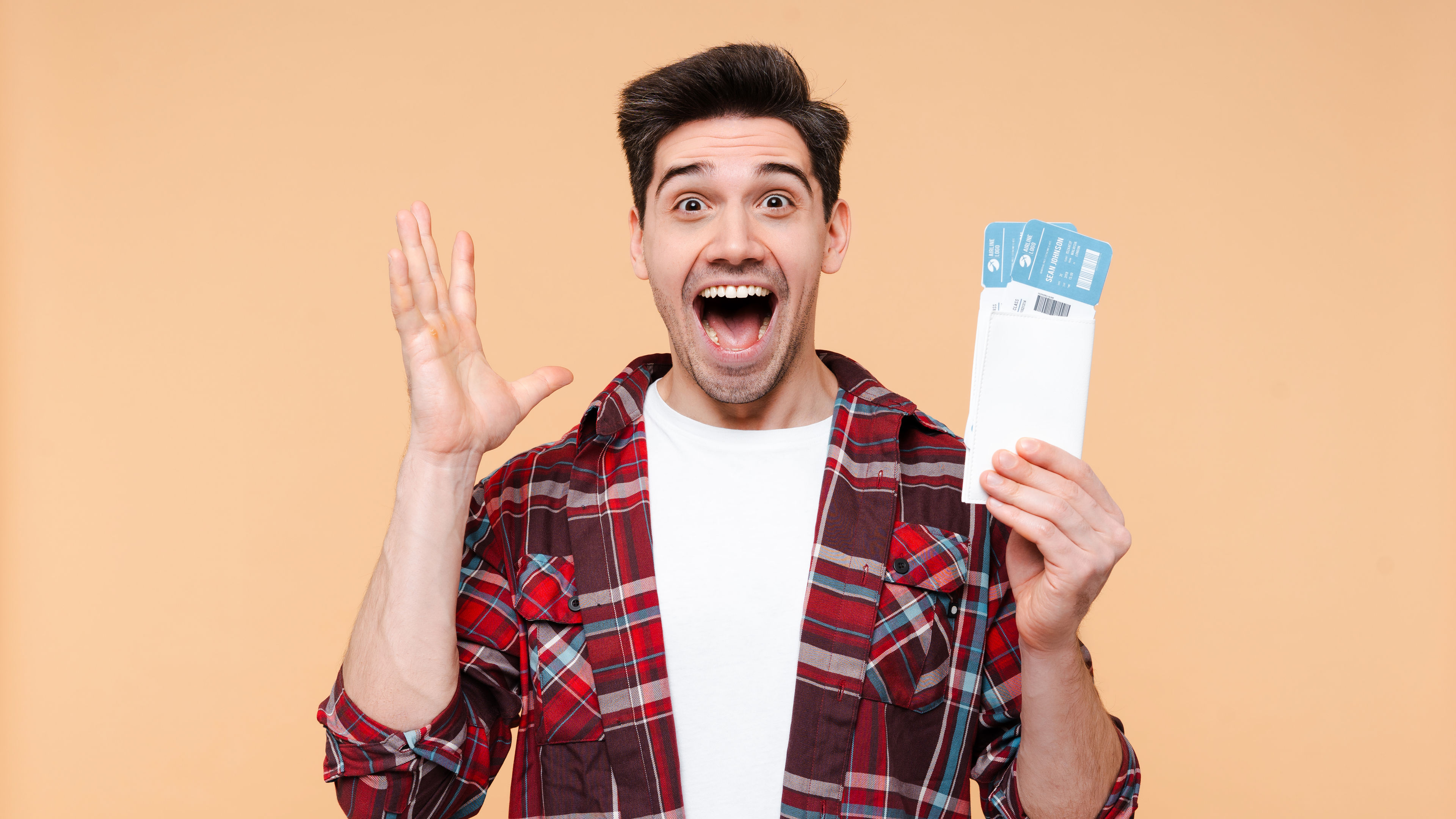 Excited Man Holding Airline Tickets for Trip