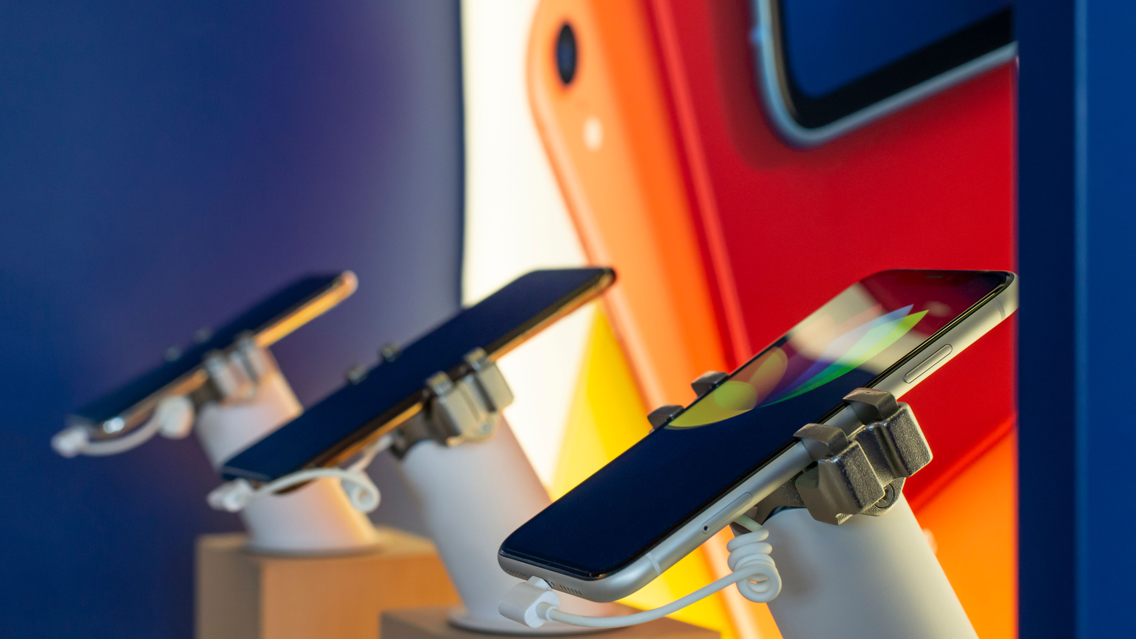 A row of smartphones in a shop 