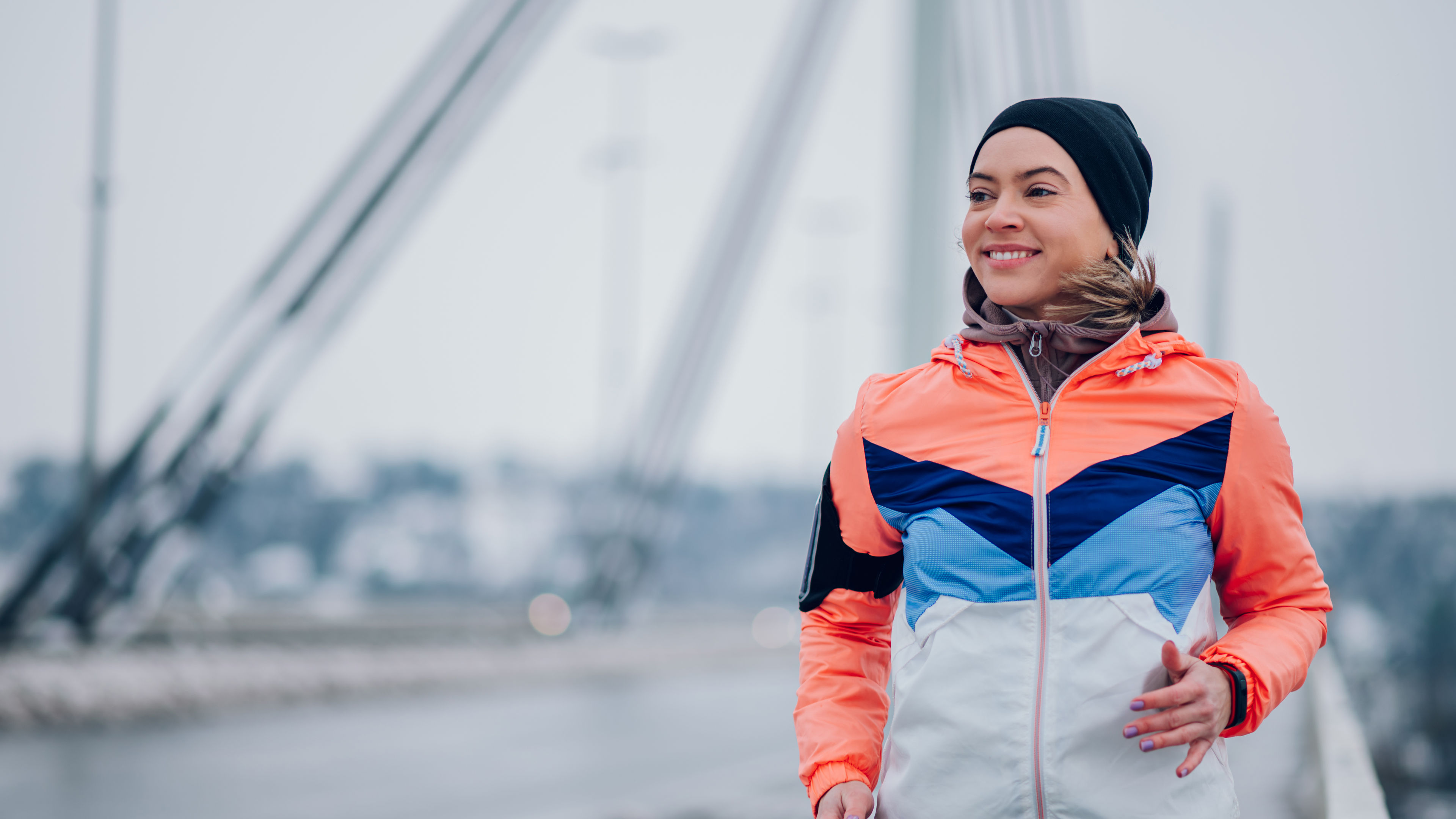 A woman in sports jacket and running
