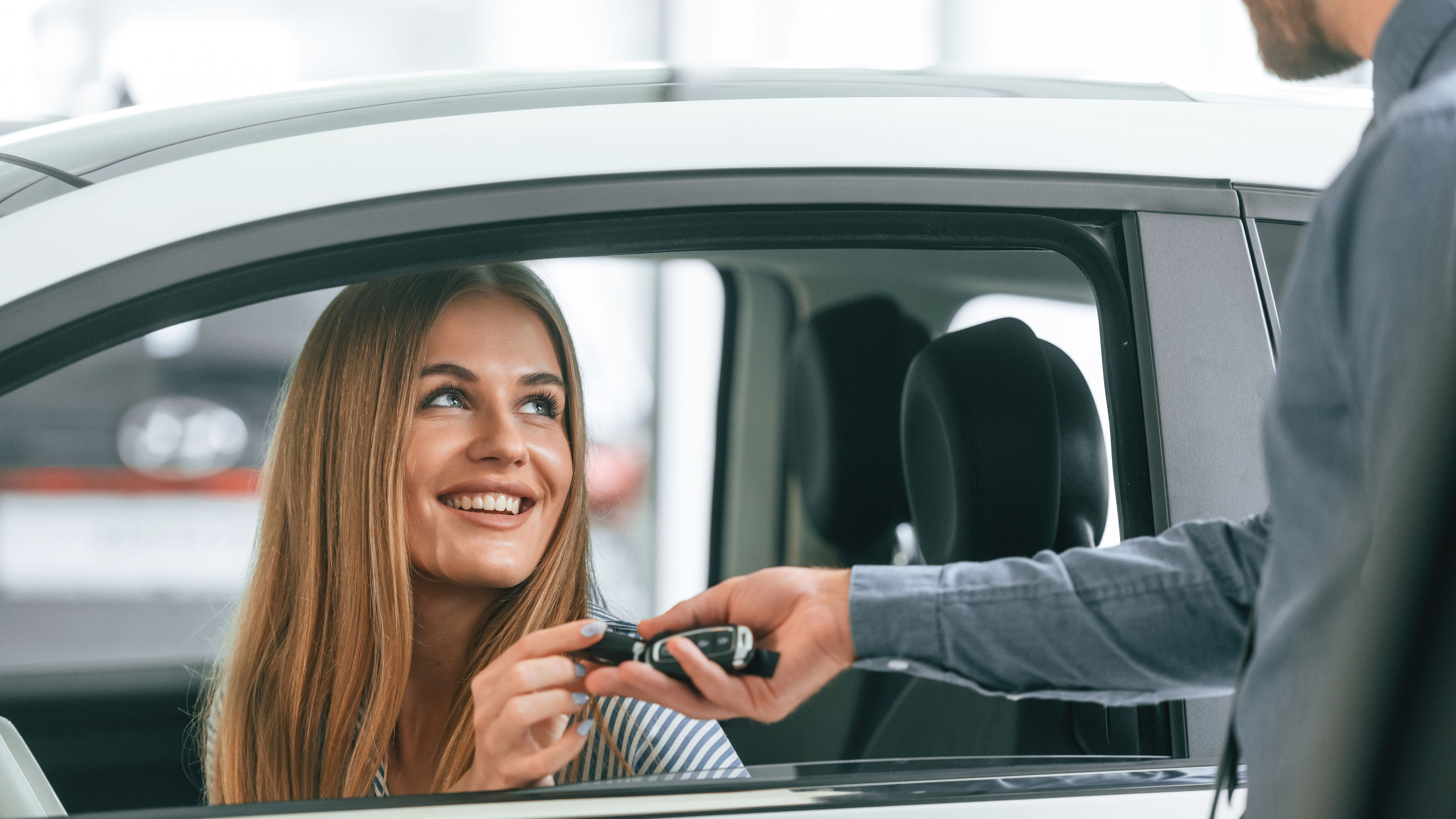 A woman renting a car