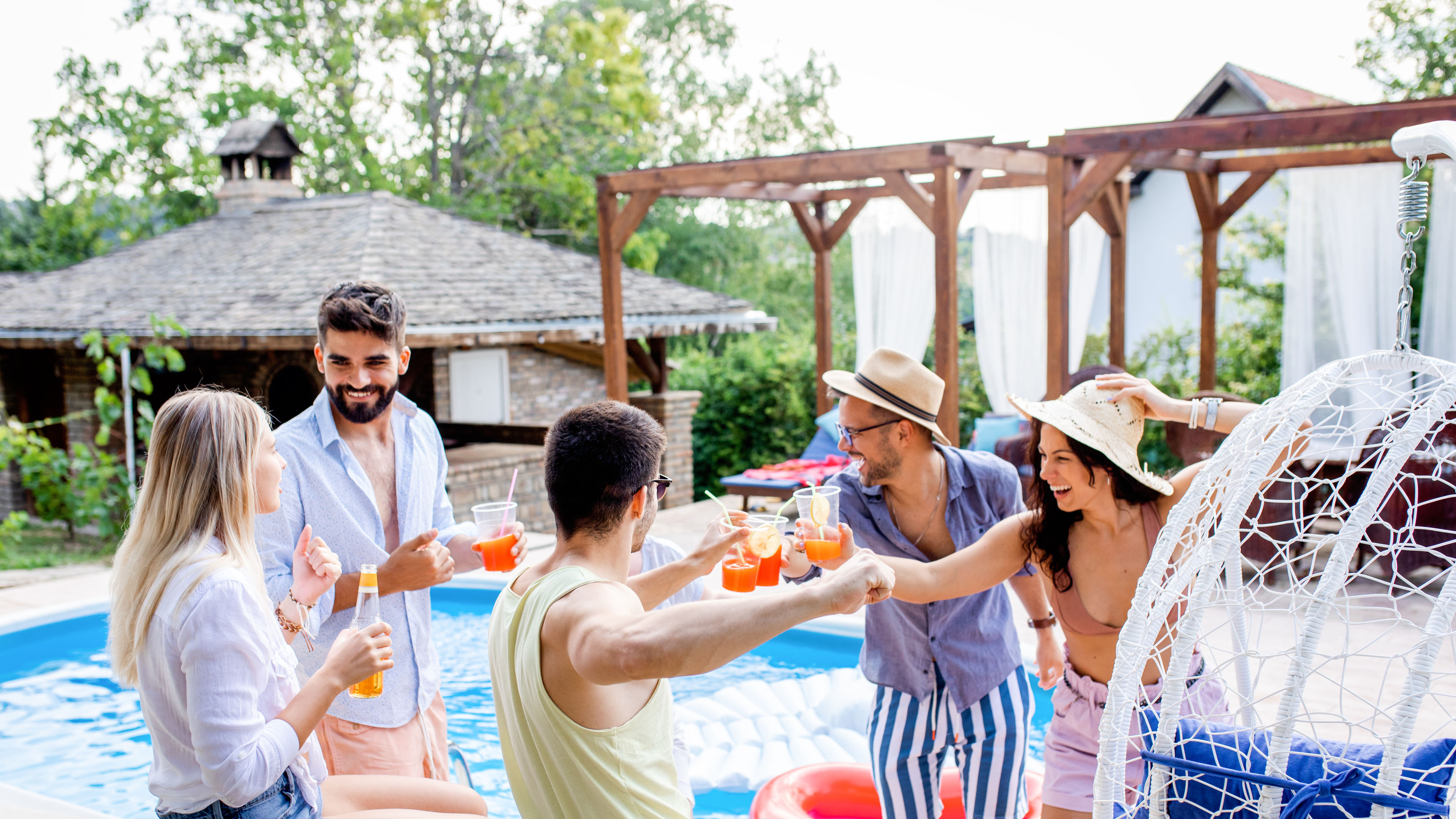 Cheerful Friends Enjoying Pool Party Celebration