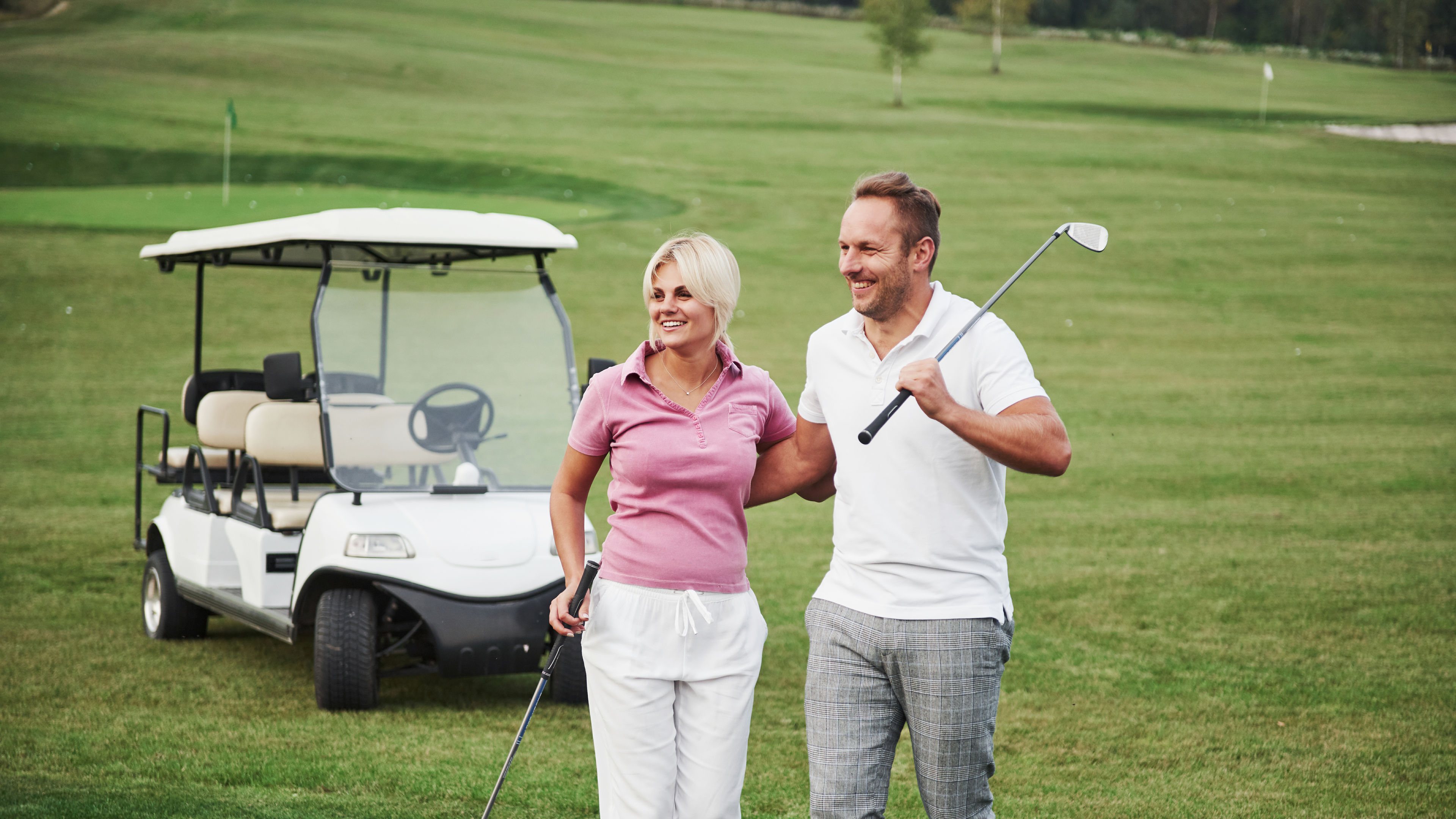 Couple playing golf