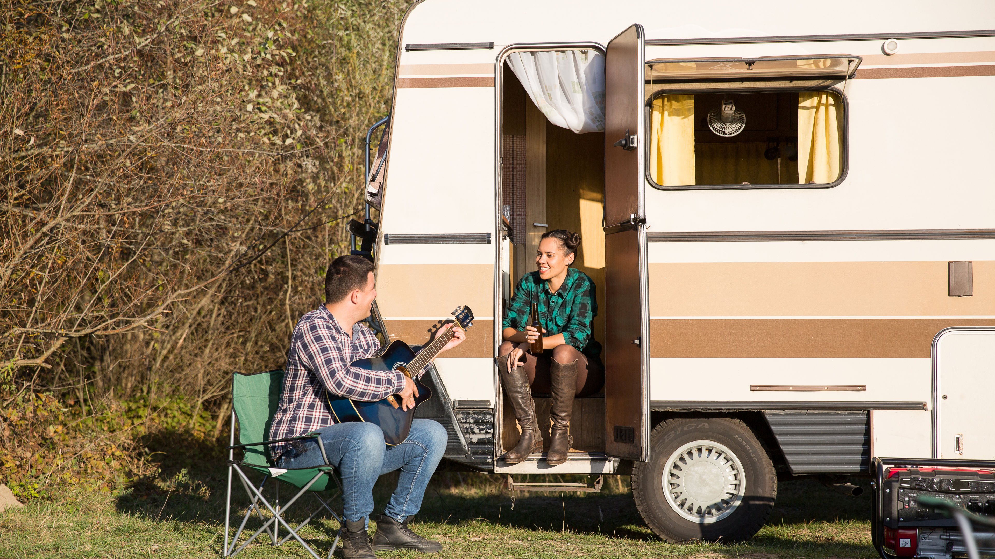 Couple Relaxing at Campsite