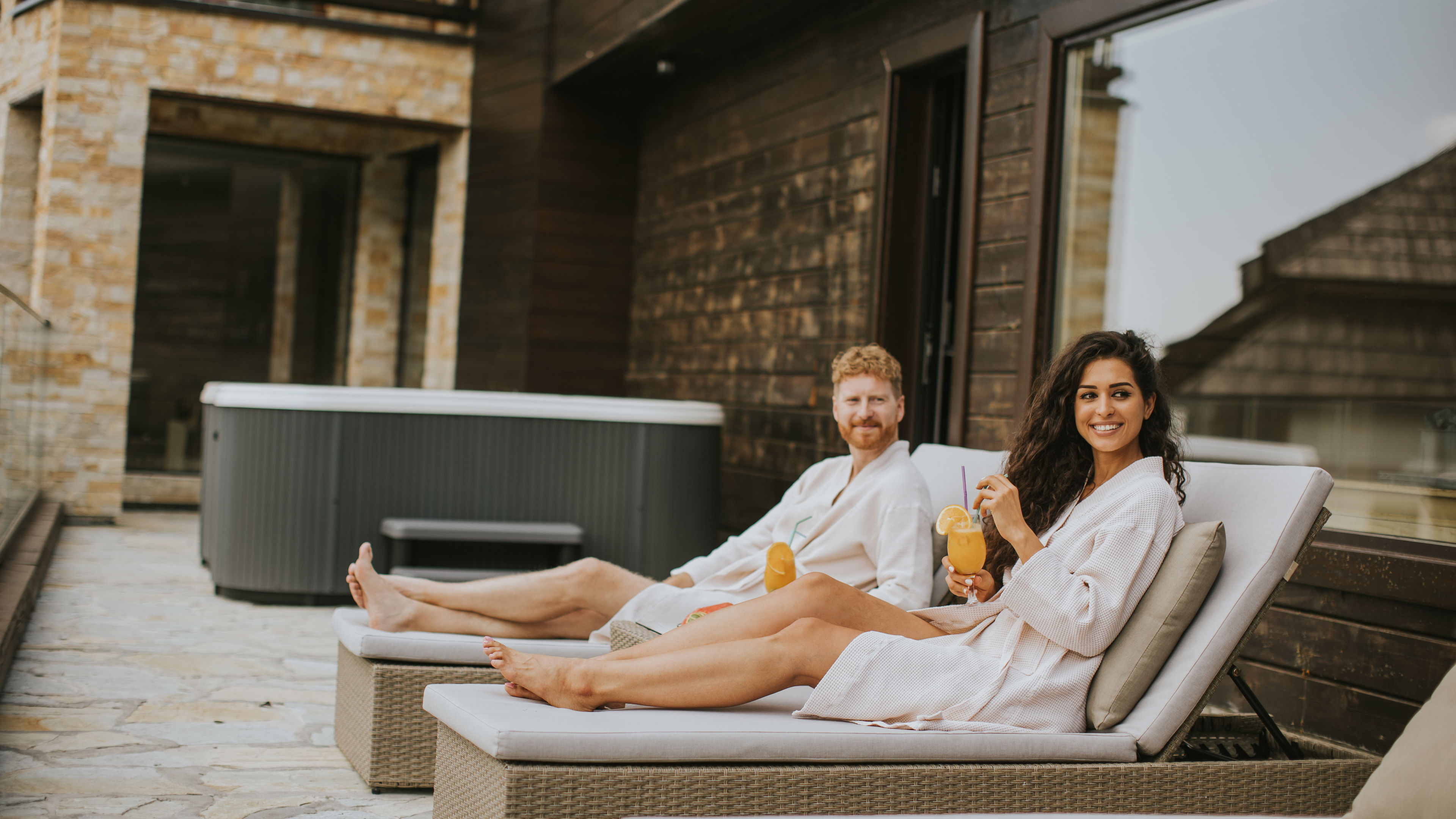 Couple sitting near to pool