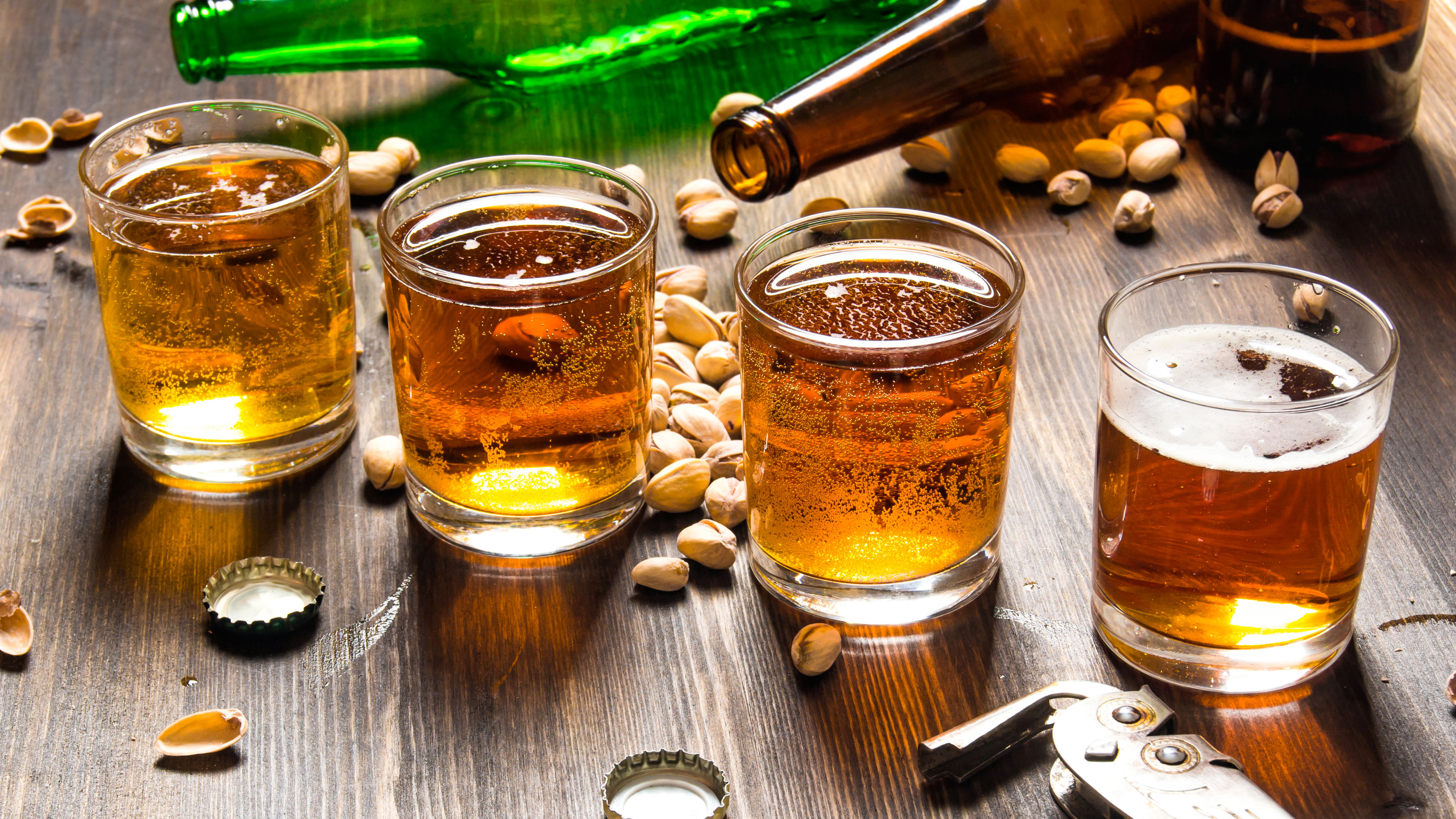 Glasses of Beer with Bottle and Pistachios