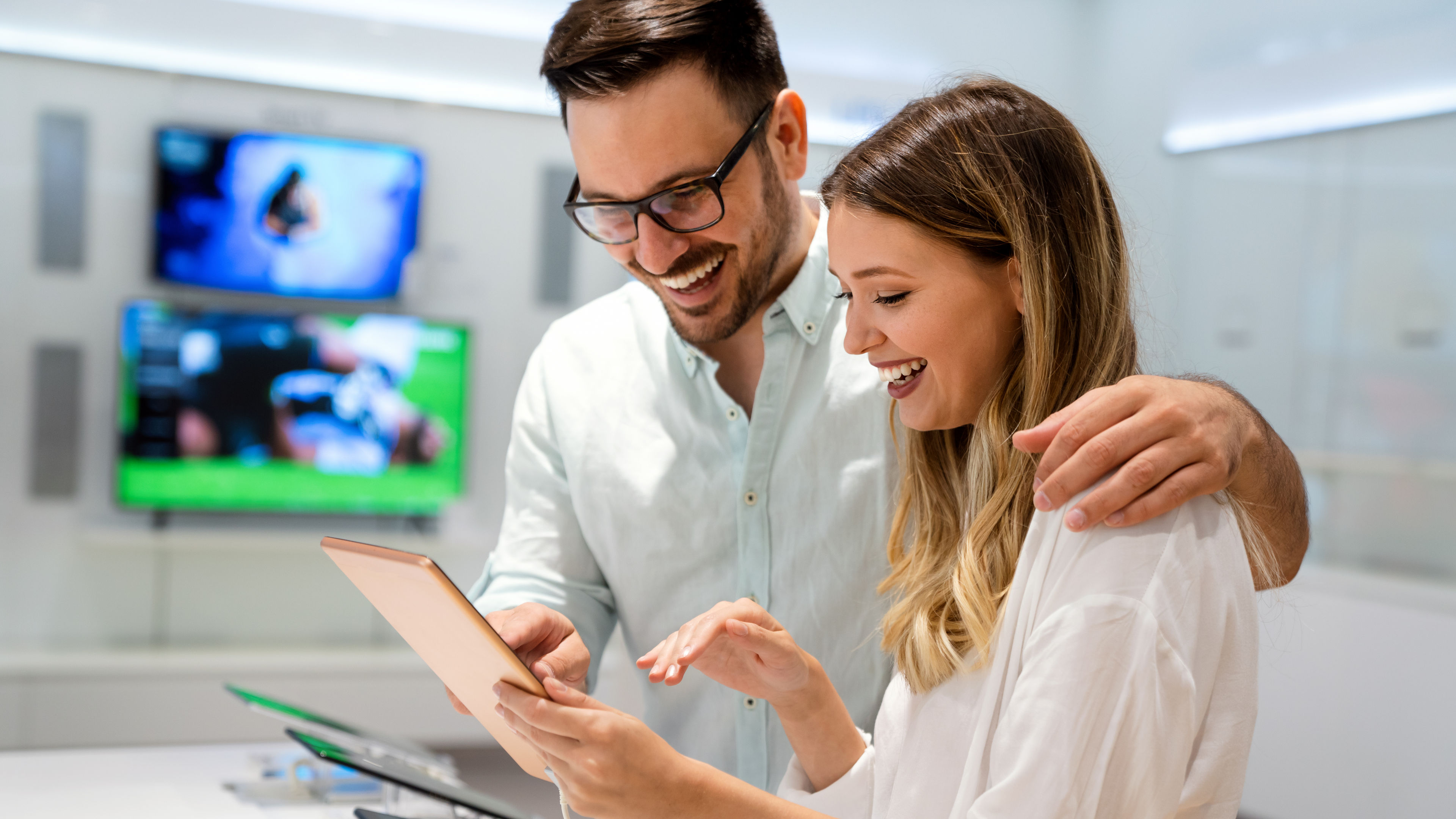 Couple shopping for a new device over their new tech purchase 